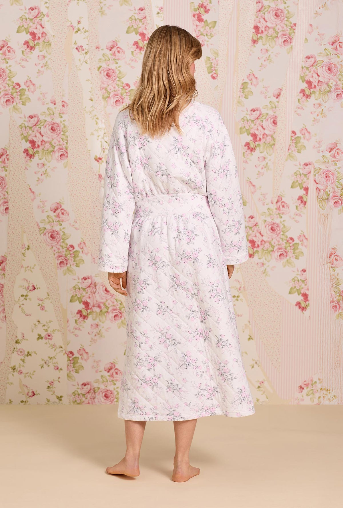 A lady wearing Quiet Bloom Cotton Diamond Quilt Wrap Robe