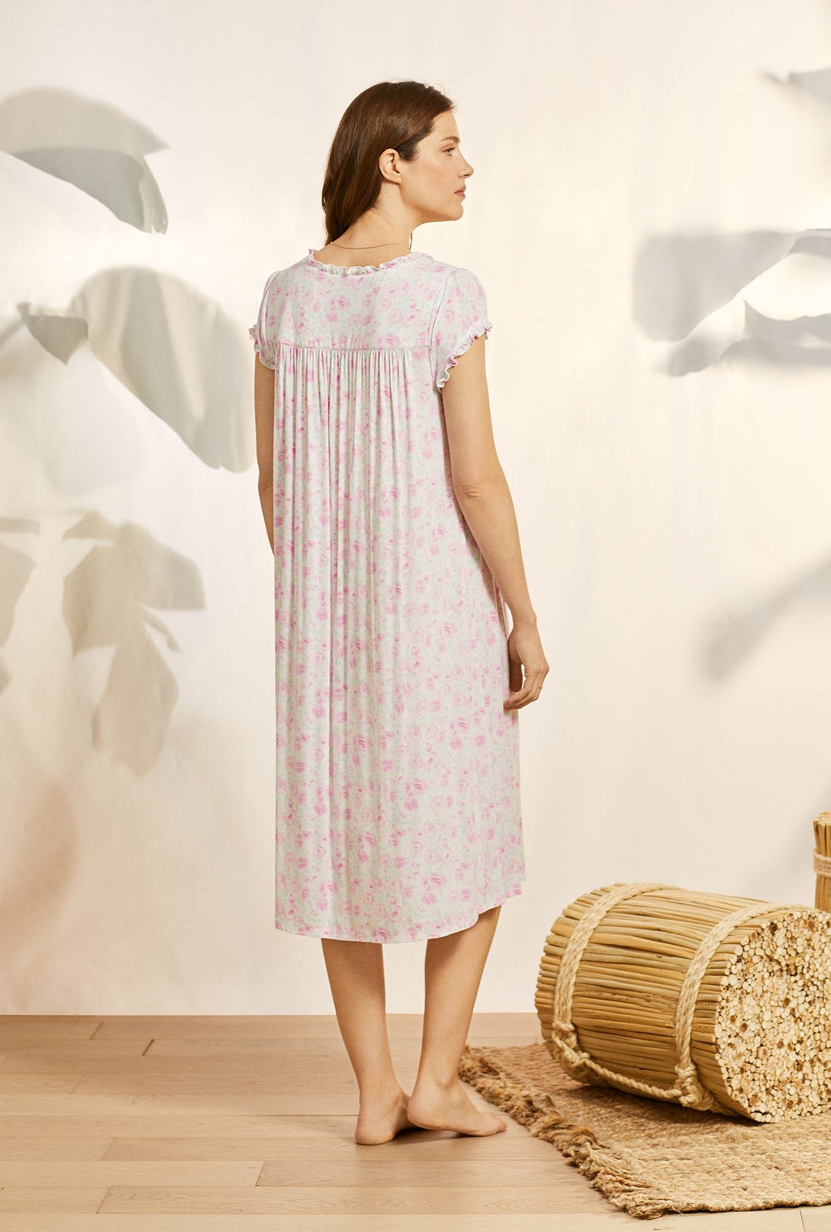A lady wearing pink cap sleeve knit waltz nightgown with tencel rosey daydream print.