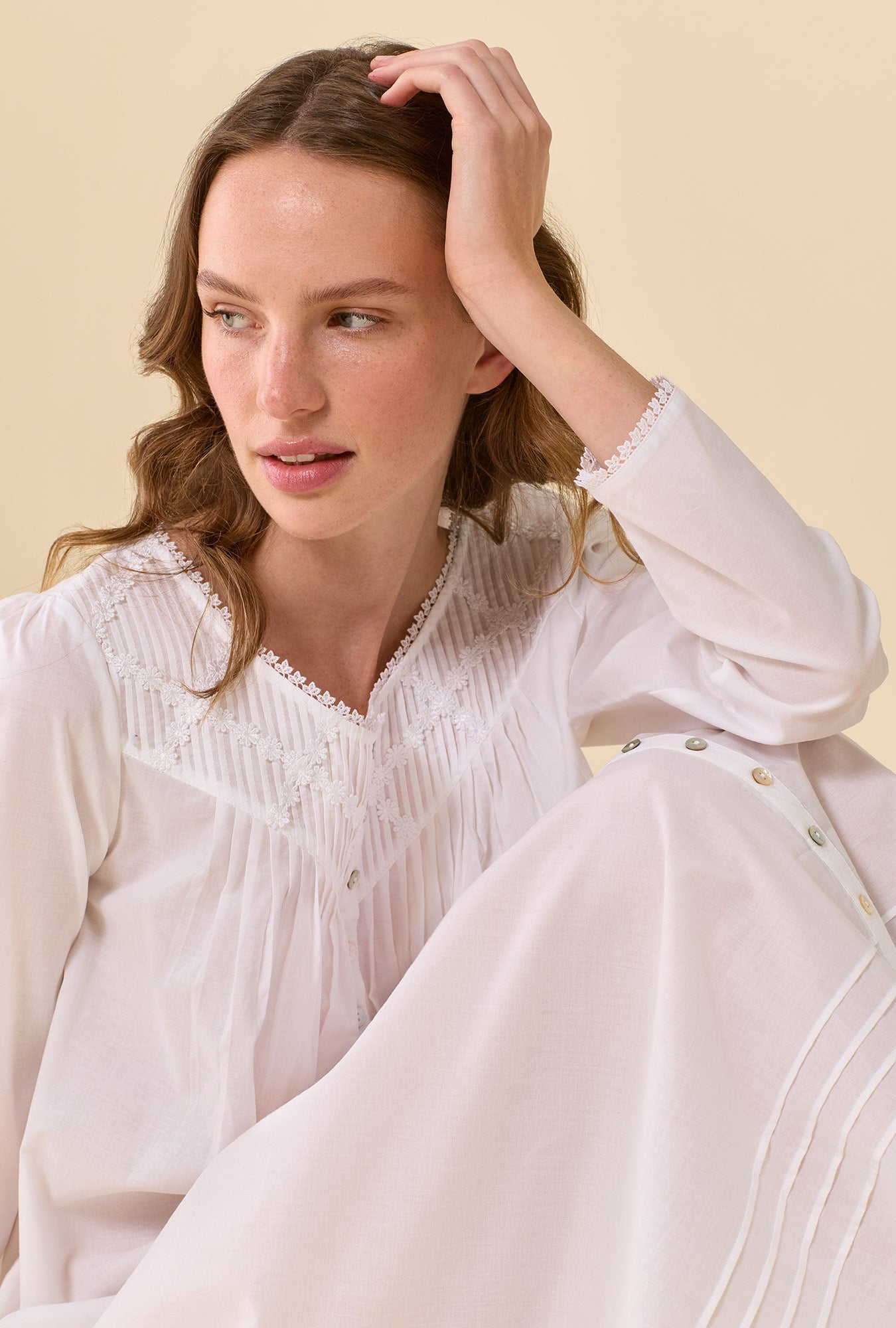 A lady wearing Iconic White Poetic Long Sleeve Robe sitting closer look