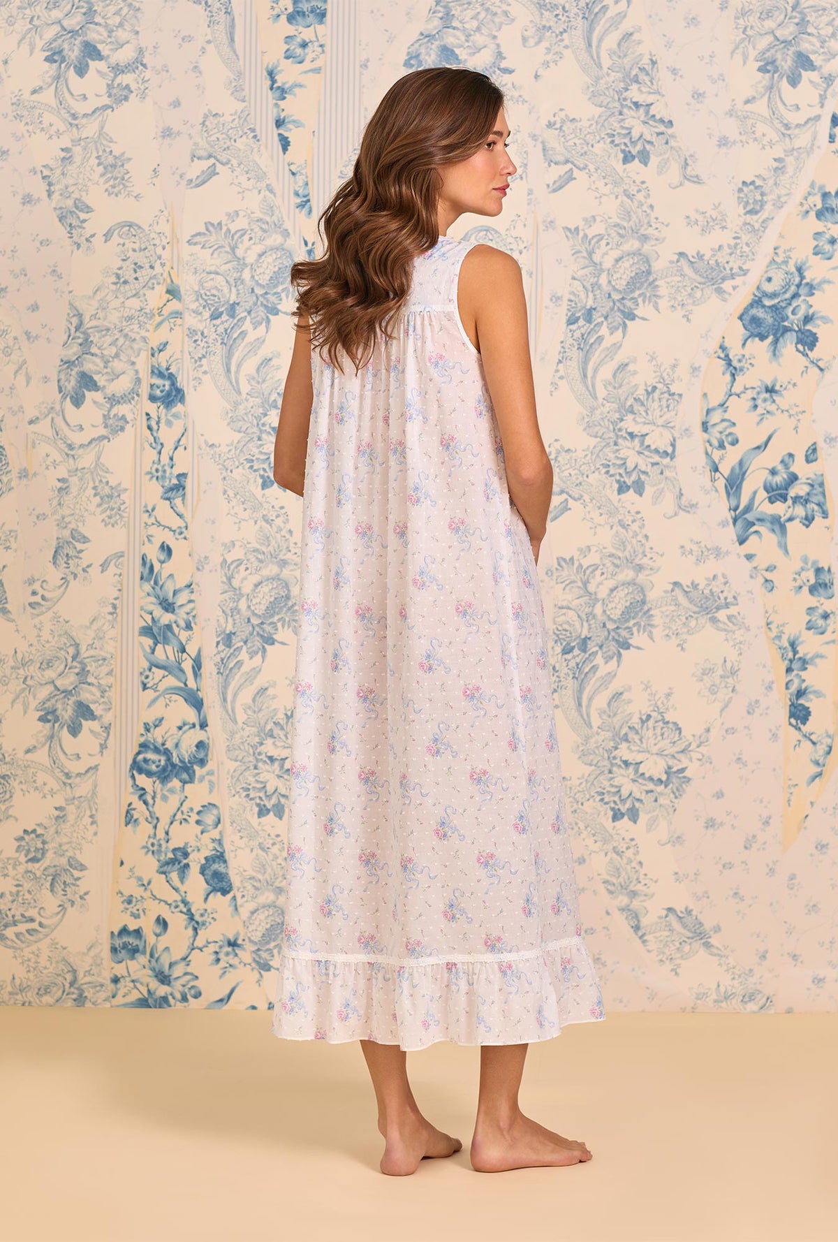 A lady wearing The "Eileen" Whispering Ribbons Cotton Swiss Dot Ballet Nightgown back view
