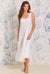 A lady wearing white nightgown