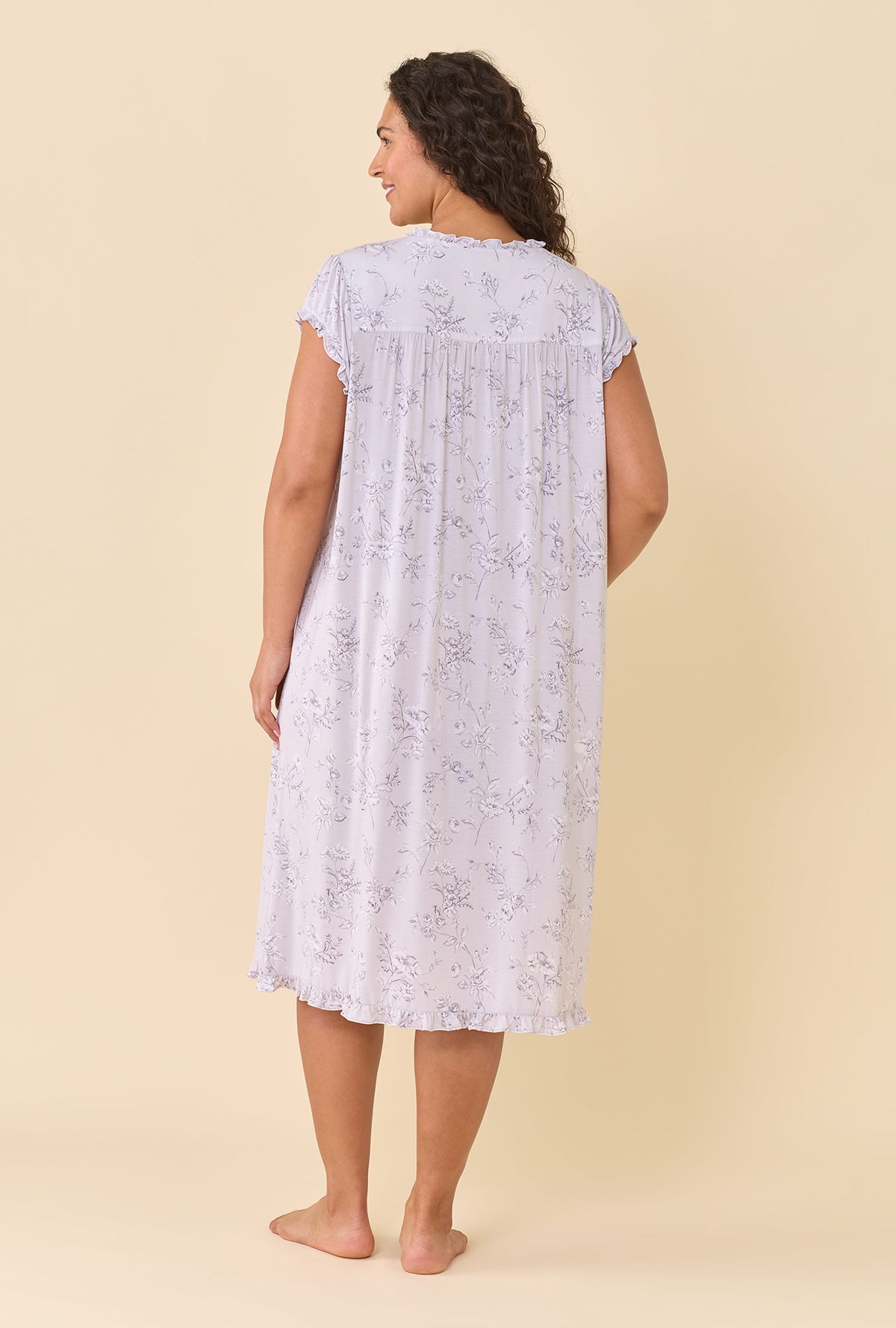 A lady wearing plus size Silver Garden Tencel™ Modal Spandex Jersey Knit Cap Sleeve Waltz Nightgown back view