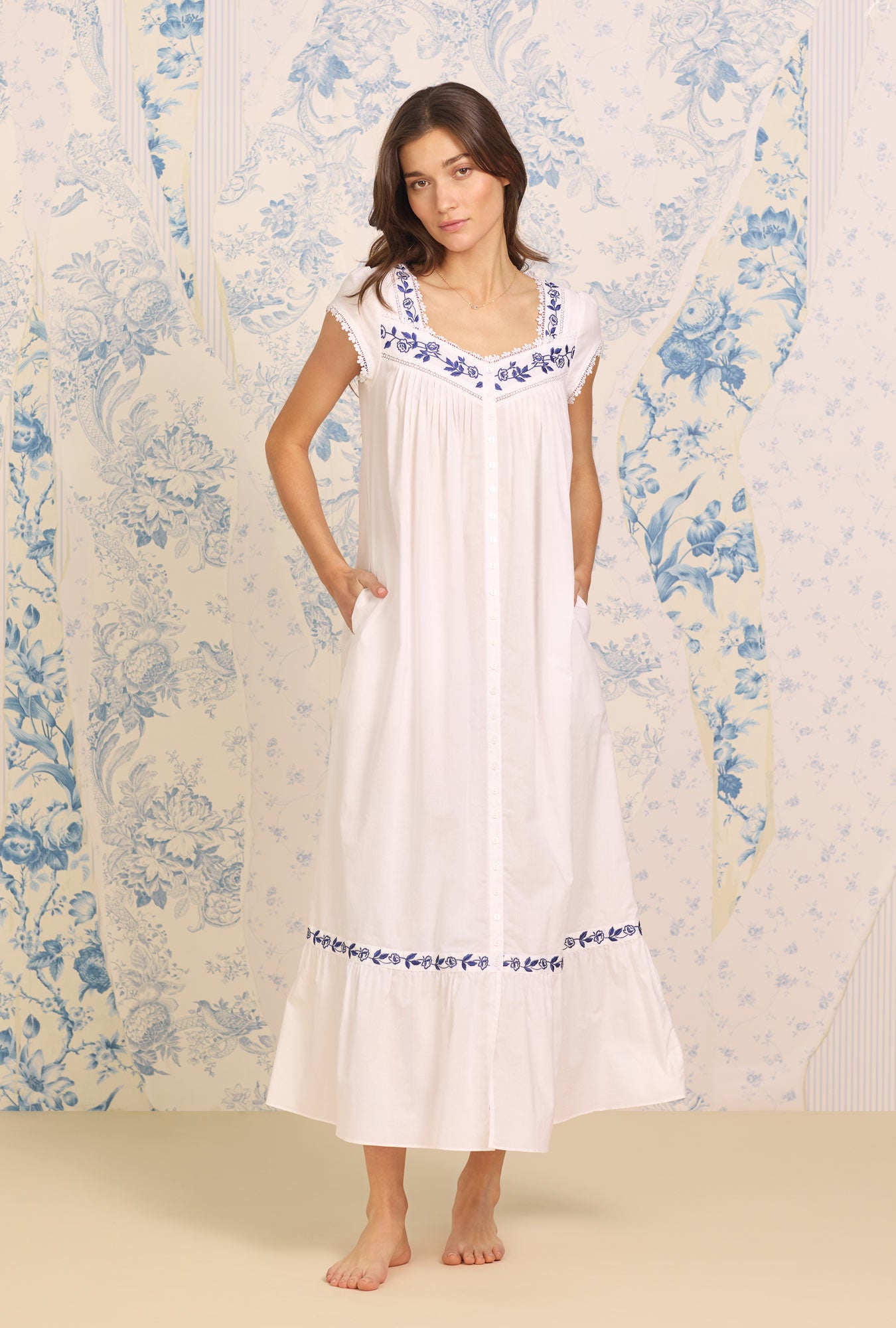 A lady wearing white sleeveless  Embroidered Cotton Robe with Dune Beach print