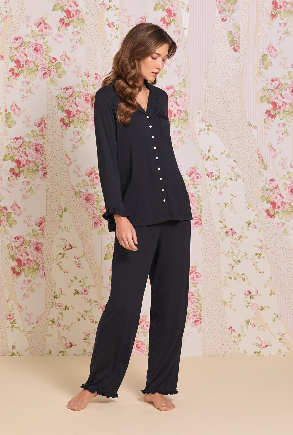 A lady wearing Iconic Black Tencel™ Modal Pajama