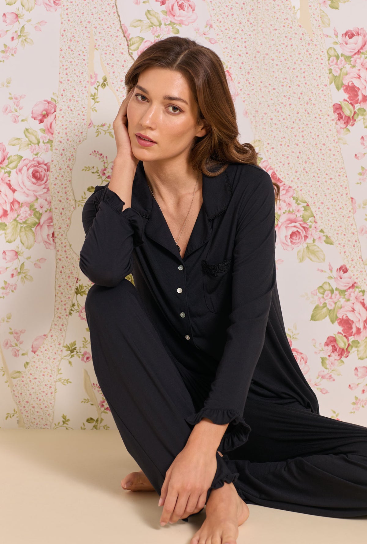 A lady wearing Iconic Black Tencel™ Modal Pajama