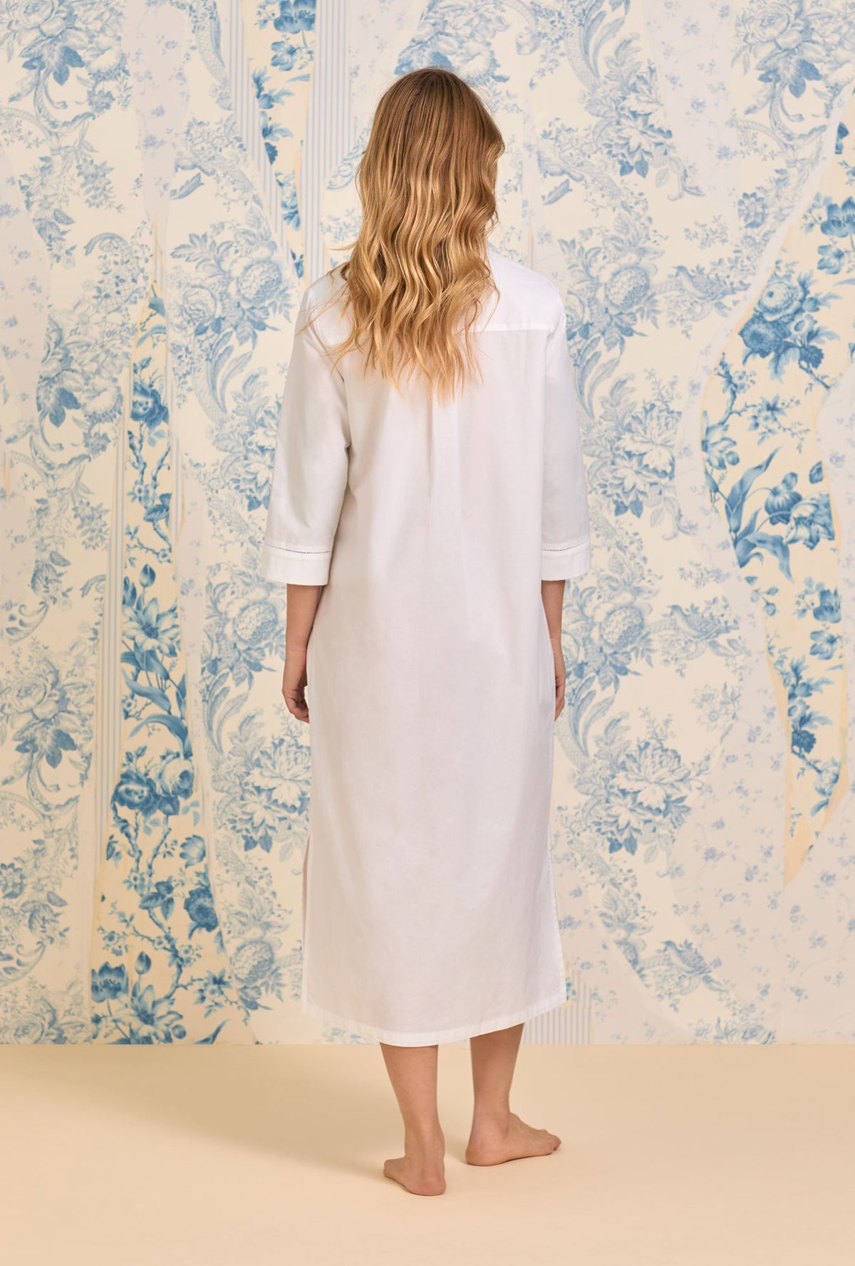 A lady wearing The &quot;Mira&quot; Iconic White Poplin Long Shirt Dress