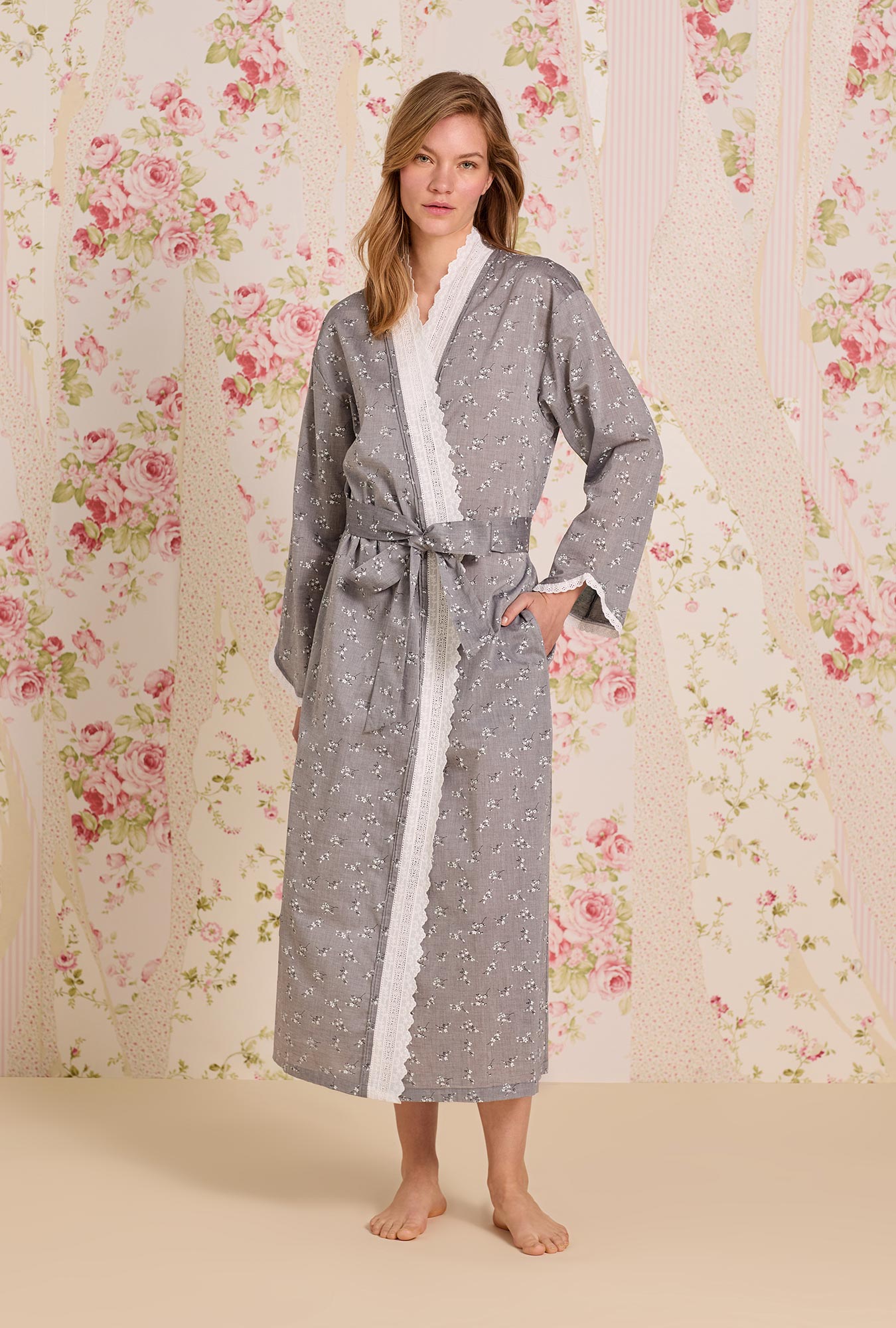 A lady wearing Pale Meadow Cotton Yarndye Chambray Wrap Robe