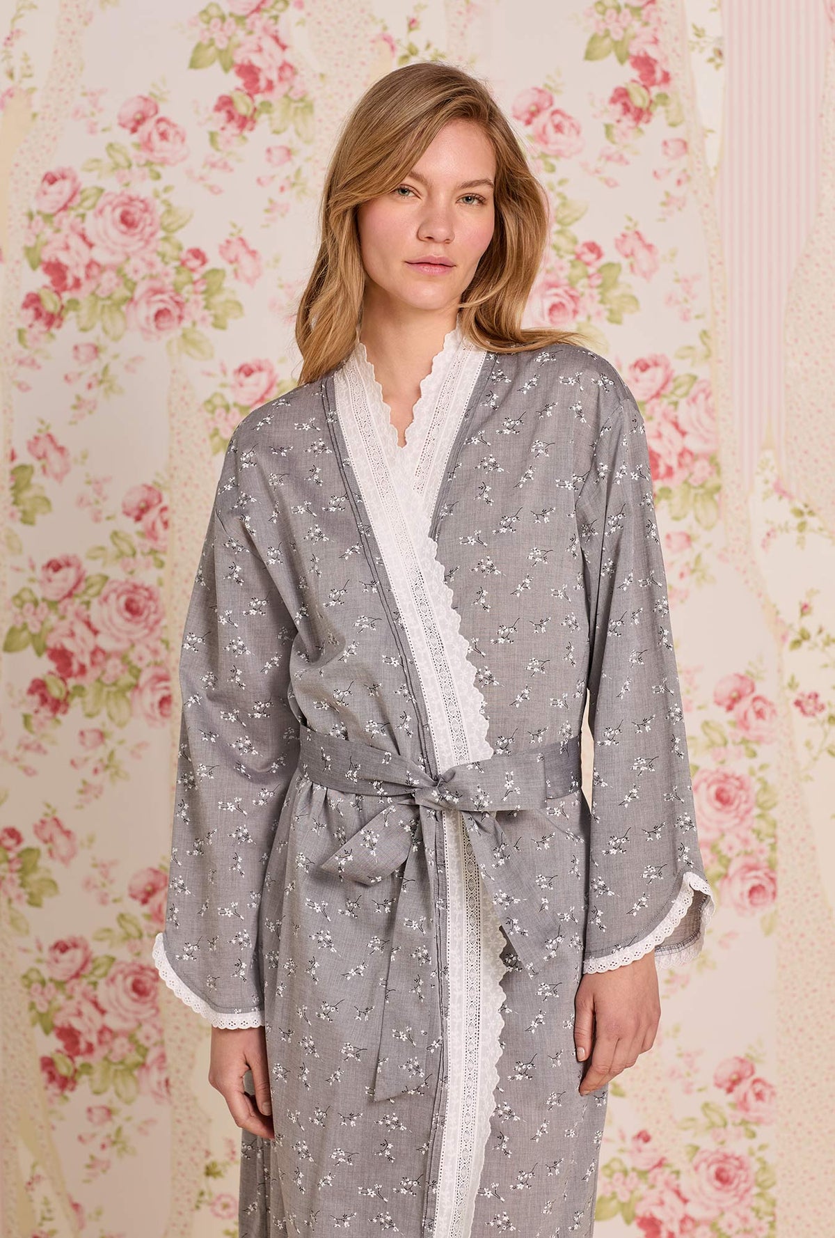 A lady wearing Pale Meadow Cotton Yarndye Chambray Wrap Robe