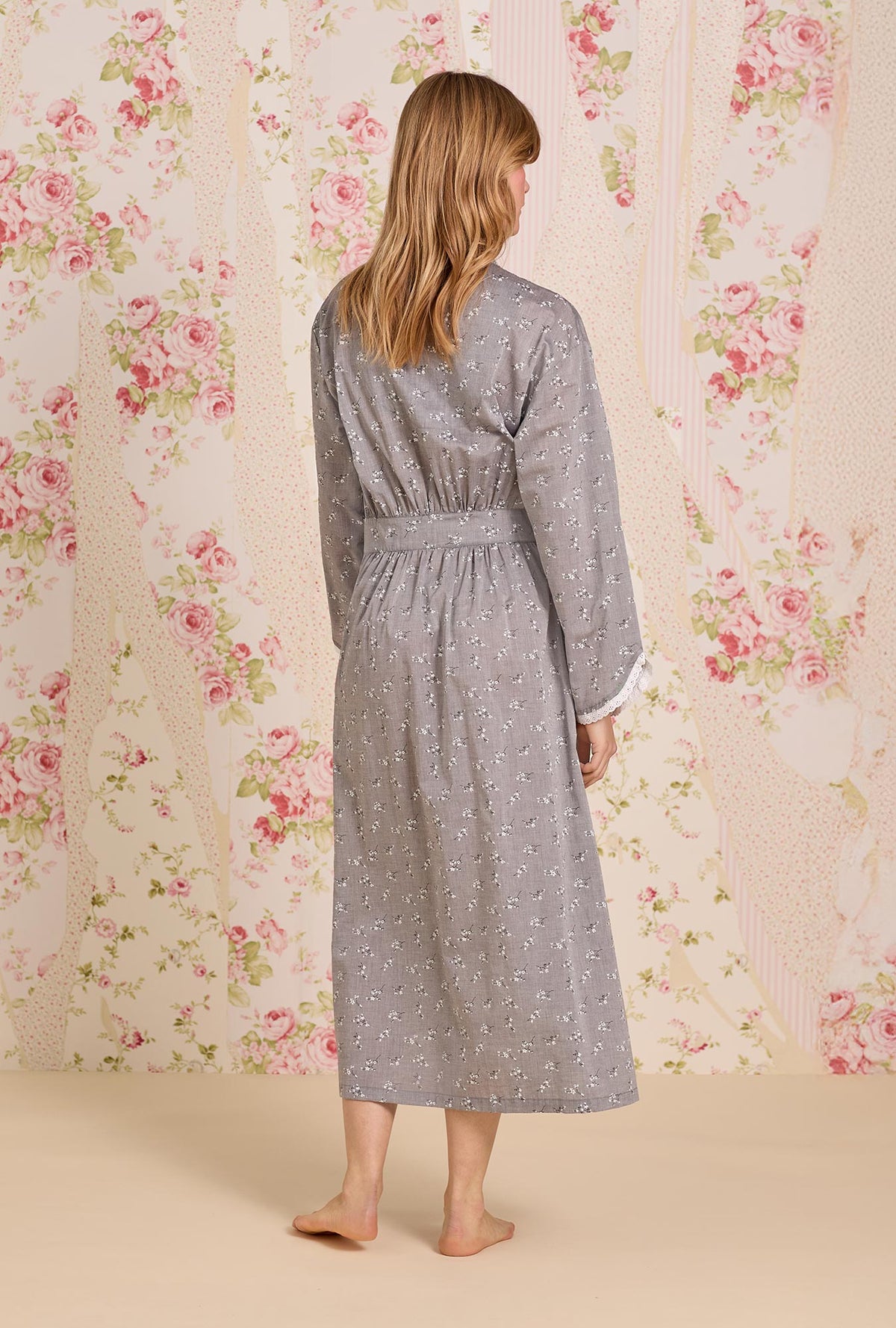 A lady wearing Pale Meadow Cotton Yarndye Chambray Wrap Robe