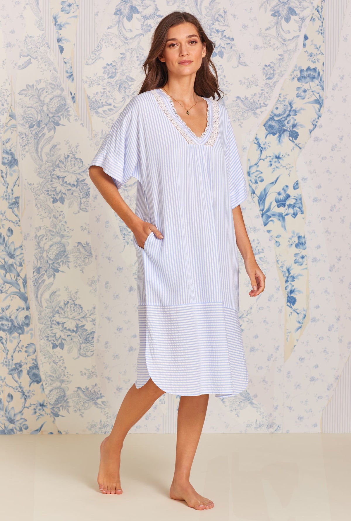 A lady wearing blue quarter sleeve Woven Caftan with Classic Peri Stripe print