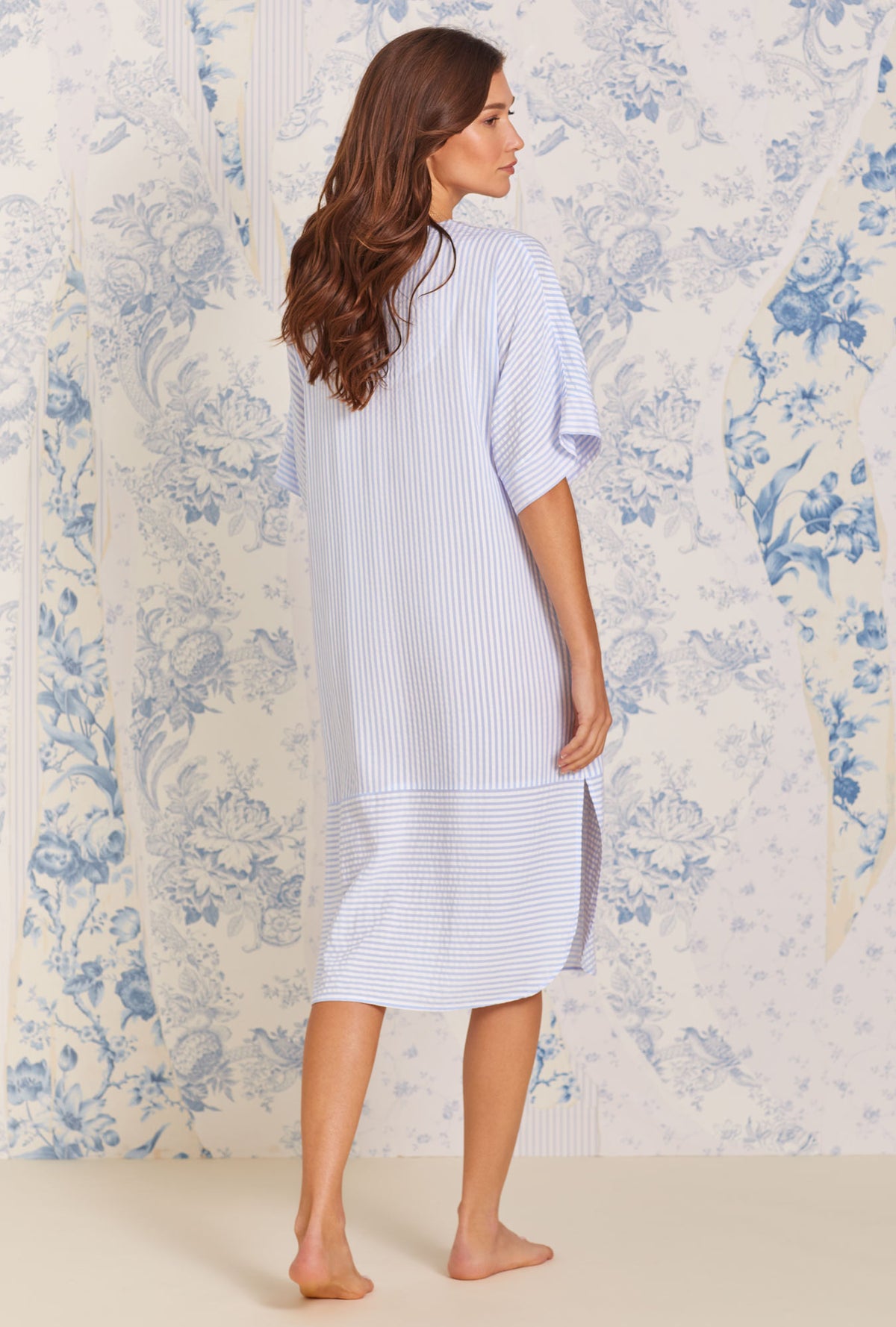 A lady wearing blue quarter sleeve Woven Caftan with Classic Peri Stripe print