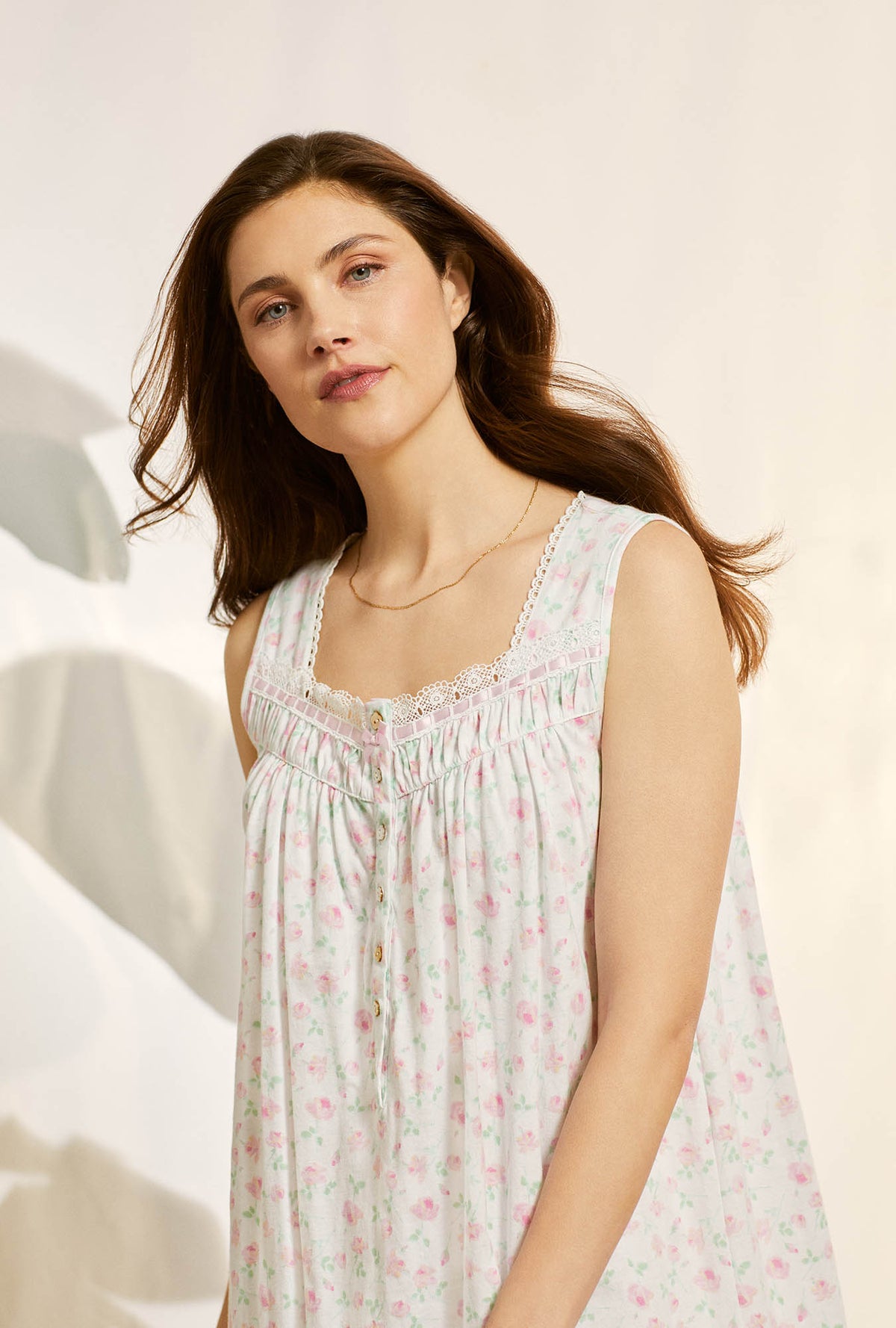 A lady wearing white sleeveless cotton knit short nightgown with petal dreams.