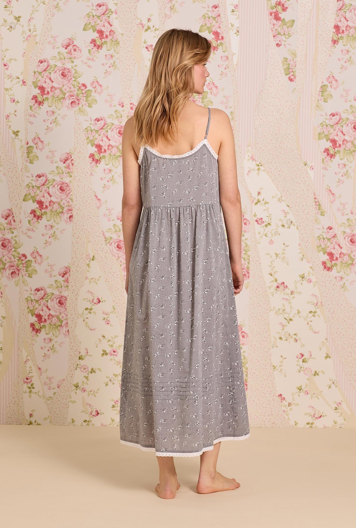 A lady wearing The &quot;Sylvie&quot; Pale Meadow Cotton Yarndye Chambray Ballet Nightgown