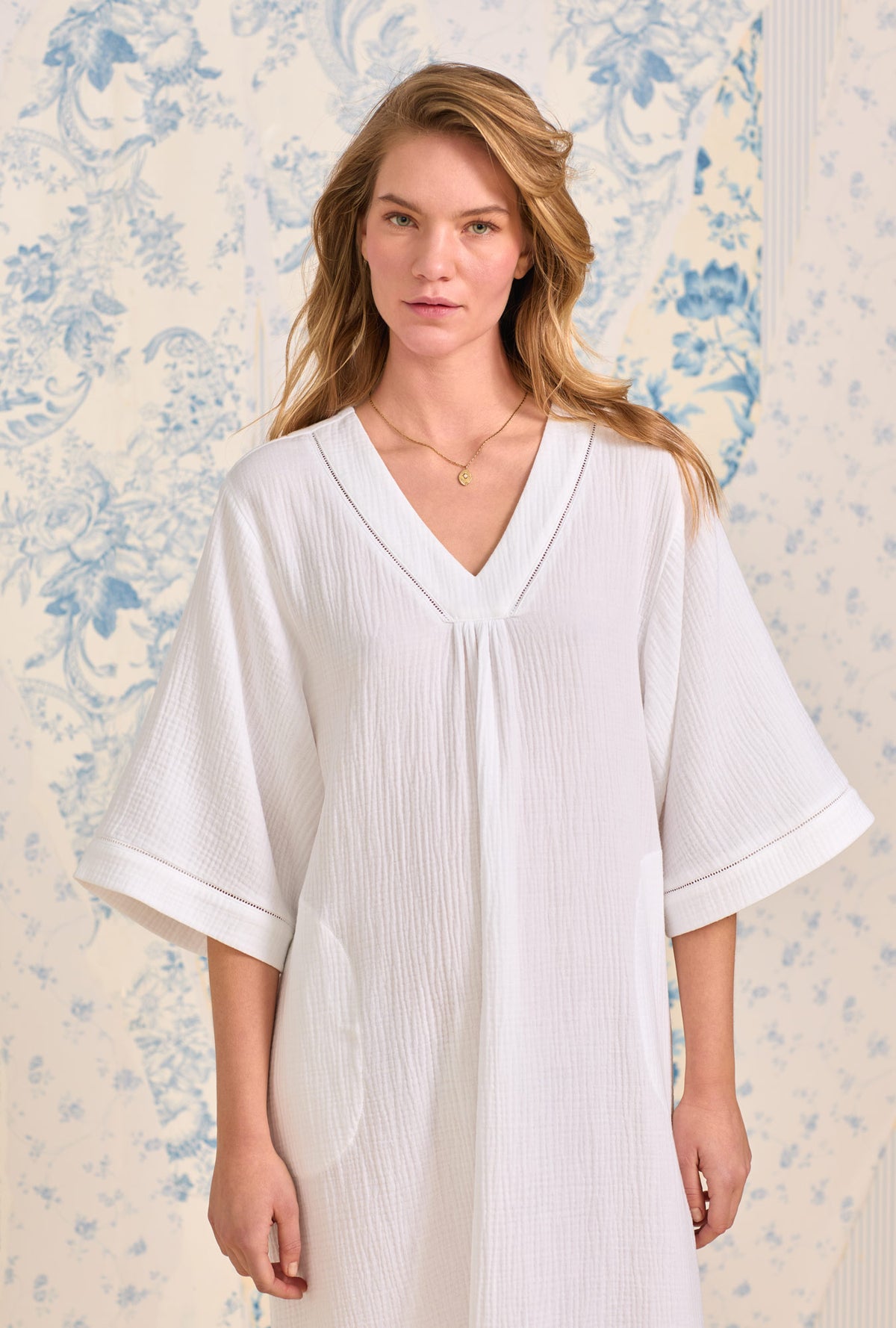 A lady wearing The &quot;Lana&quot; White Crinkle Gauze Classic Caftan