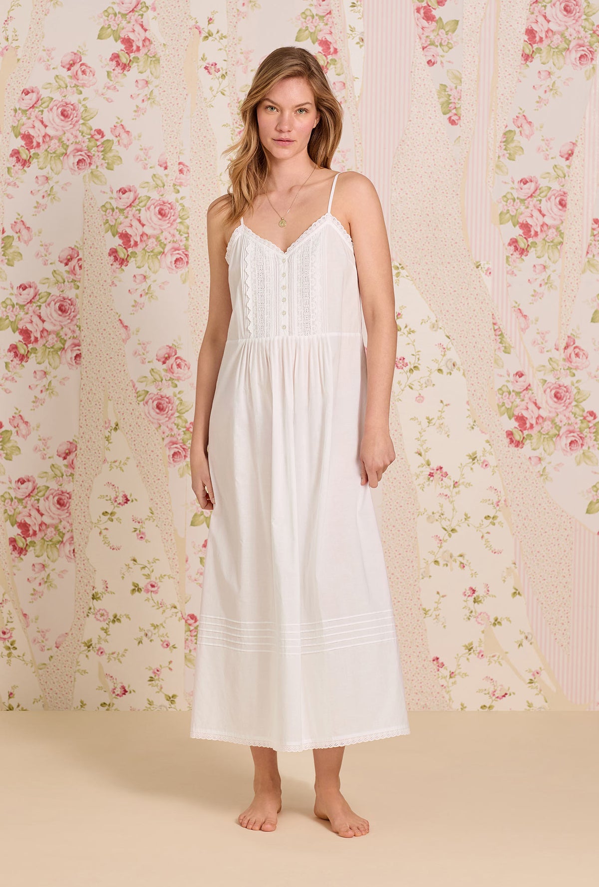 A lady wearing The &quot;Sylvie&quot; Iconic White Cotton Yarndye Chambray Ballet Nightgown