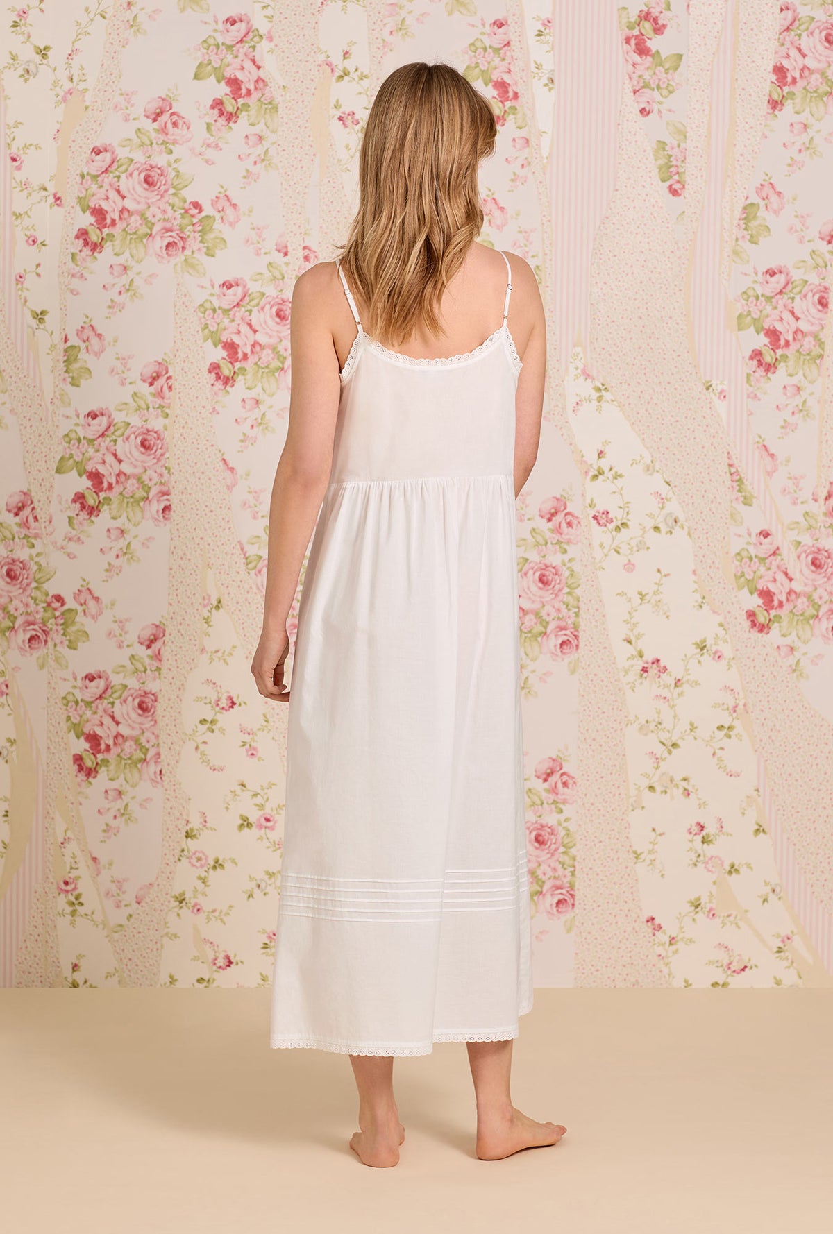 A lady wearing The &quot;Sylvie&quot; Iconic White Cotton Yarndye Chambray Ballet Nightgown