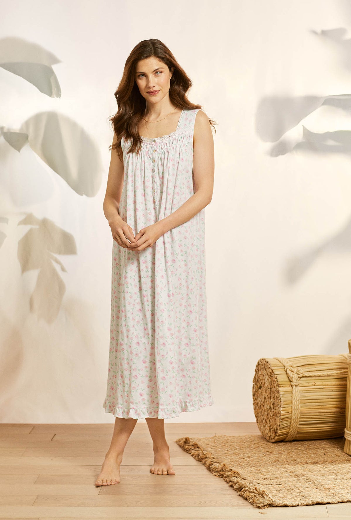A lady wearing white sleeveless cotton knit long nightgown with petal dreams.