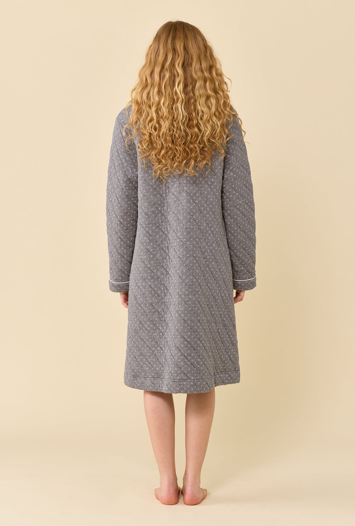 A lady wearing Gray Pearl Cotton Rich Diamond Quilt Waltz Zip Robe back view