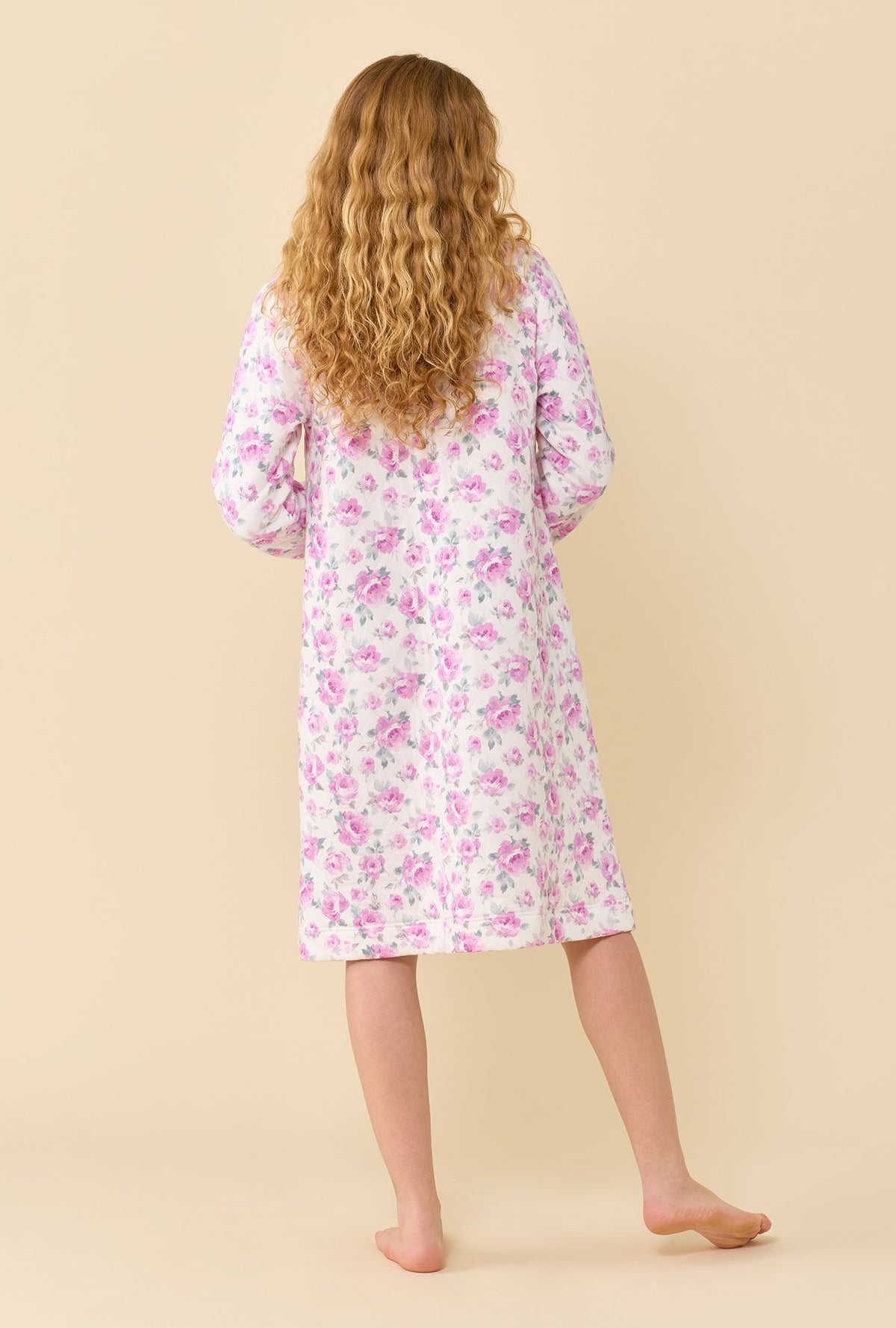 A lady wearing Antique Rose Cotton Rich Diamond Quilt Waltz Zip Robe back view