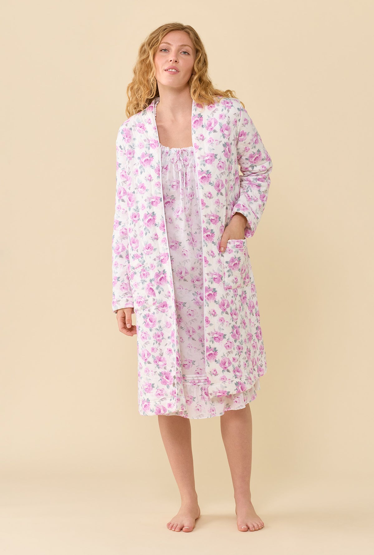 A lady wearing Antique Rose Cotton Rich Diamond Quilt Waltz Zip Robe