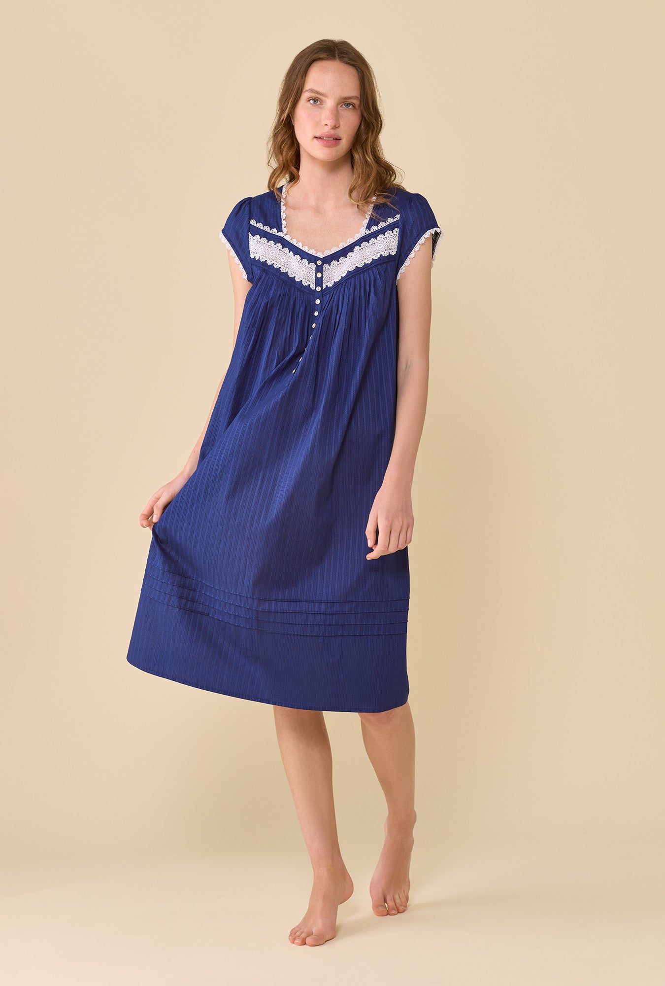 A lady wearing Navy The Alice Cotton Dobby Stripe Nightgown