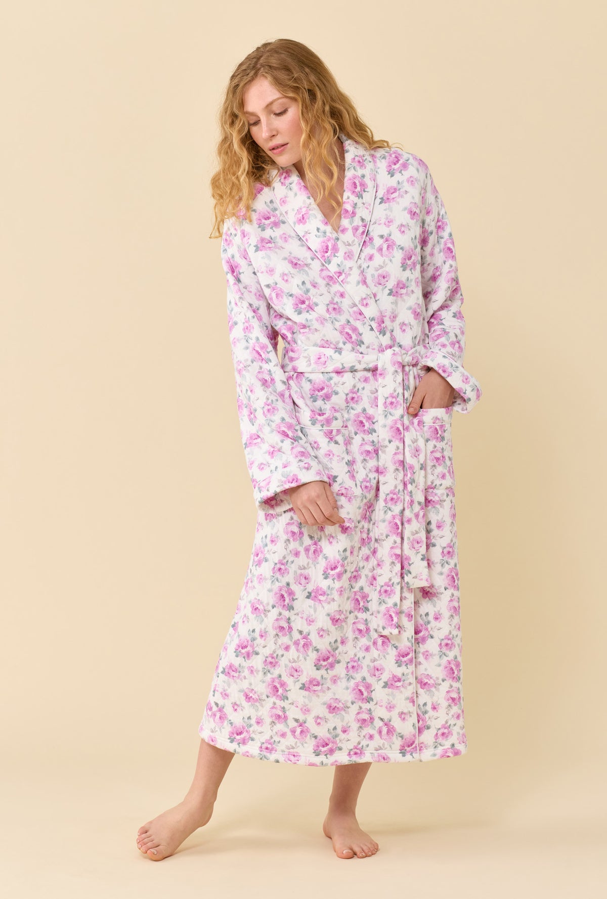 A lady wearing Antique Rose Cotton Rich Diamond Quilt Ballet Wrap Robe