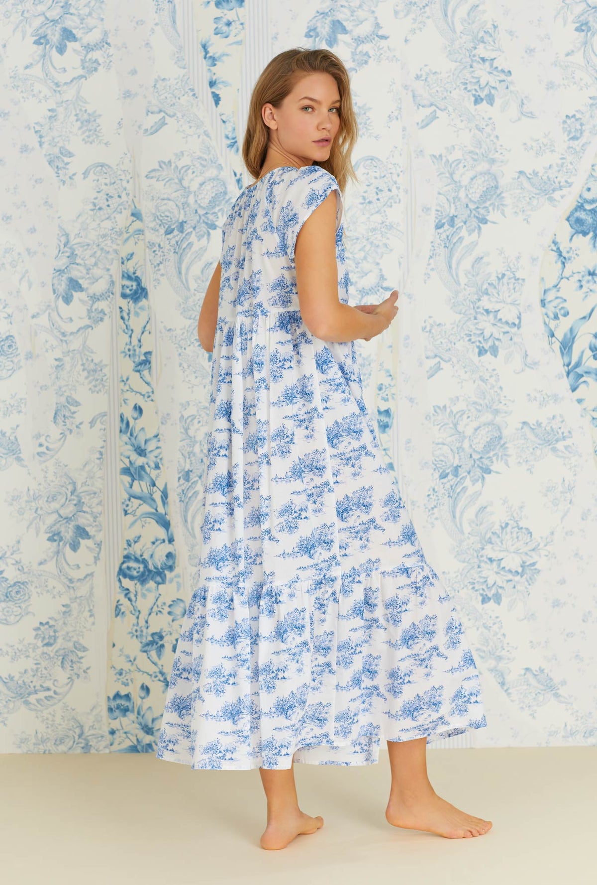 A lady wearing cap sleeve french toile juliette cotton woven long nightgown.