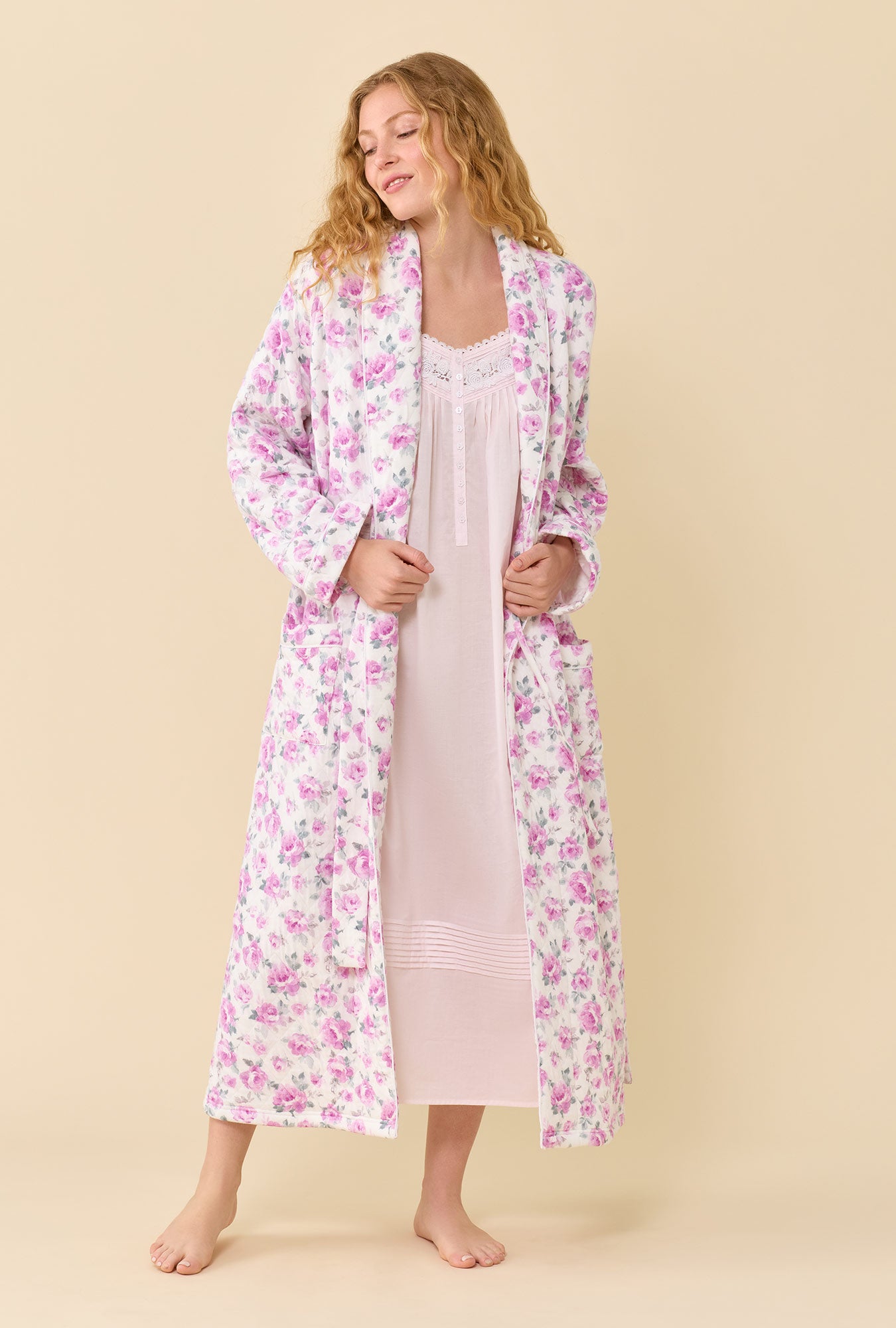 A lady wearing Antique Rose Cotton Rich Diamond Quilt Ballet Wrap Robe looking down