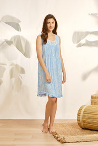 A lady wearing blue sleeveless knit short chemise with tencel delphinium summer print.