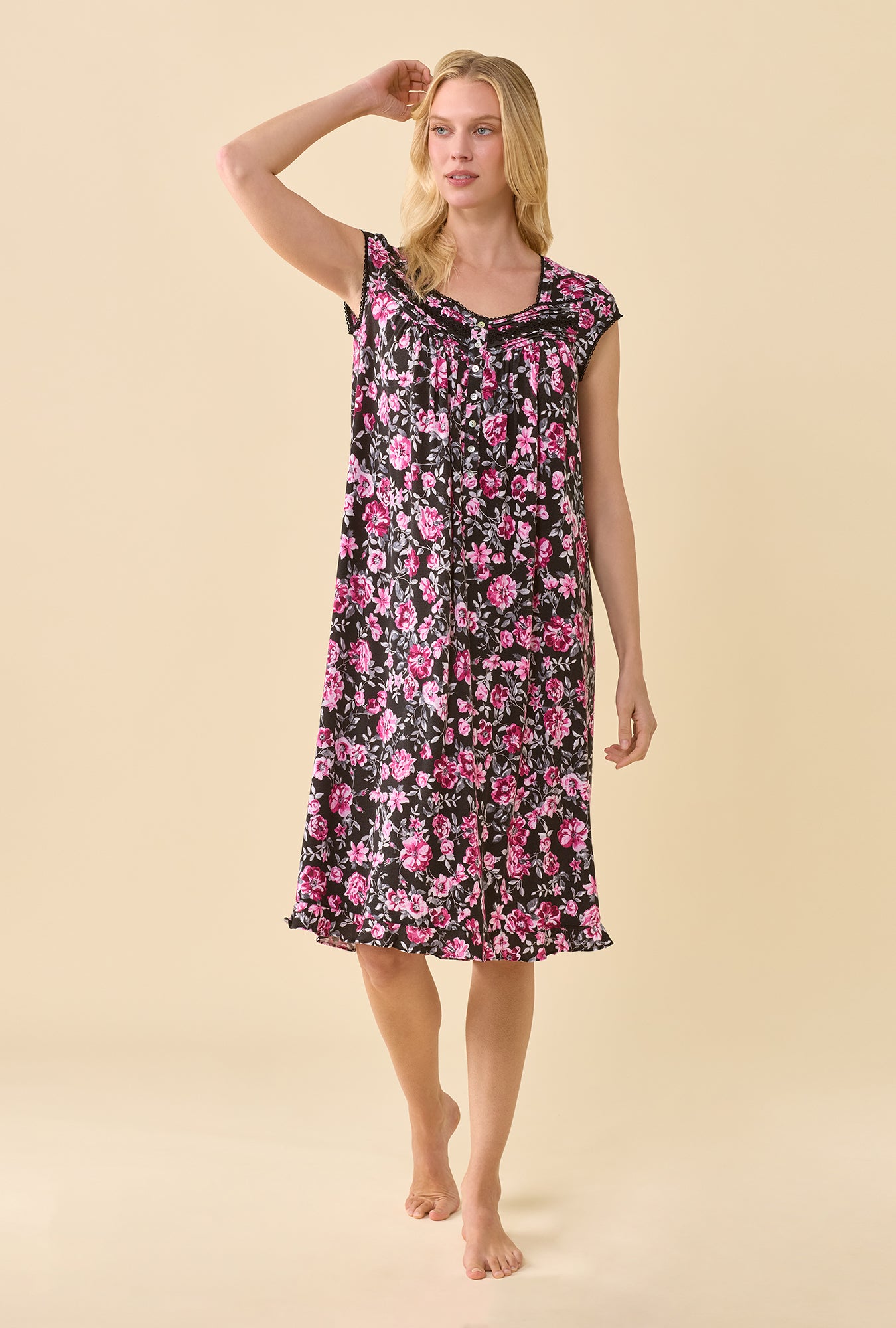 A lady wearing Midnight Briar TENCEL™ Modal Spandex Jersey KnitCap Sleeve Waltz Nightgown one hand up