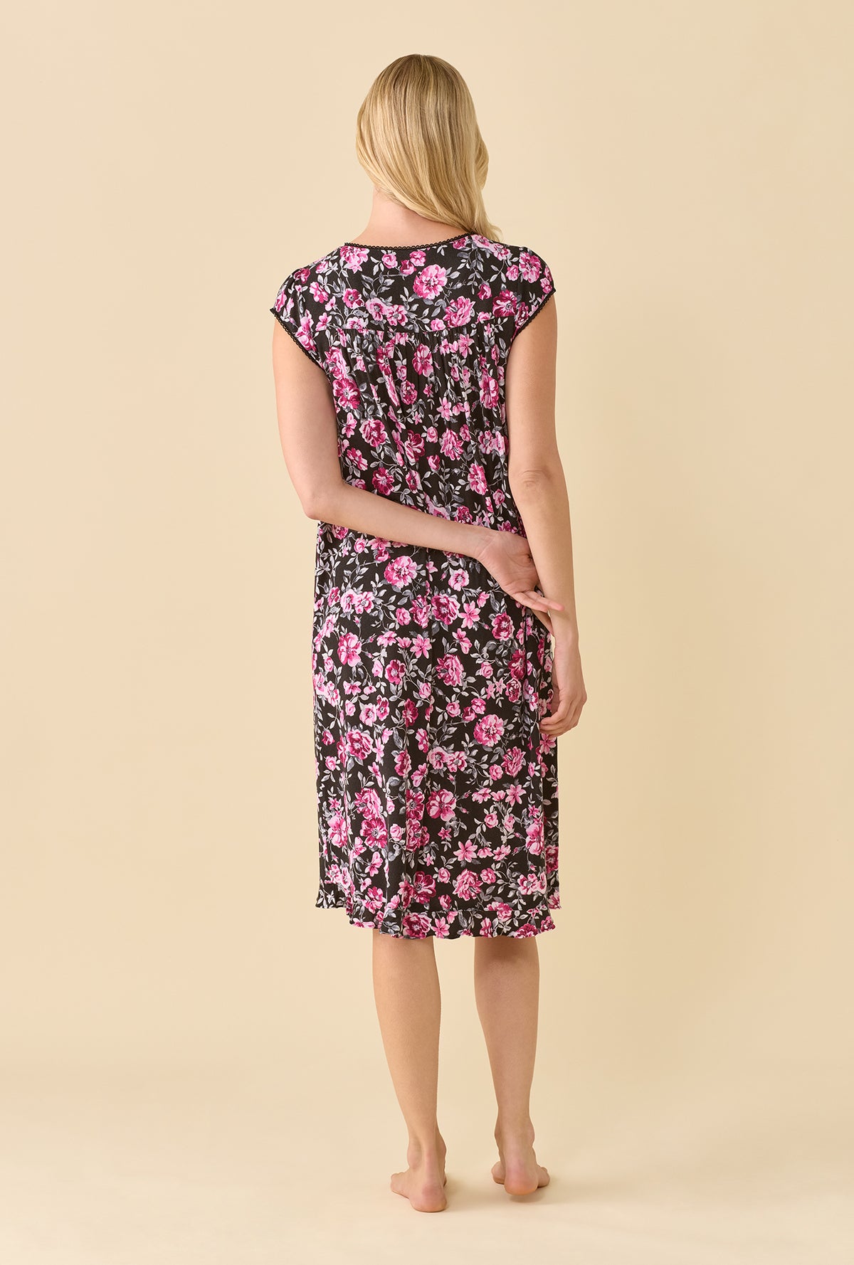 A lady wearing Midnight Briar TENCEL™ Modal Spandex Jersey KnitCap Sleeve Waltz Nightgown back view