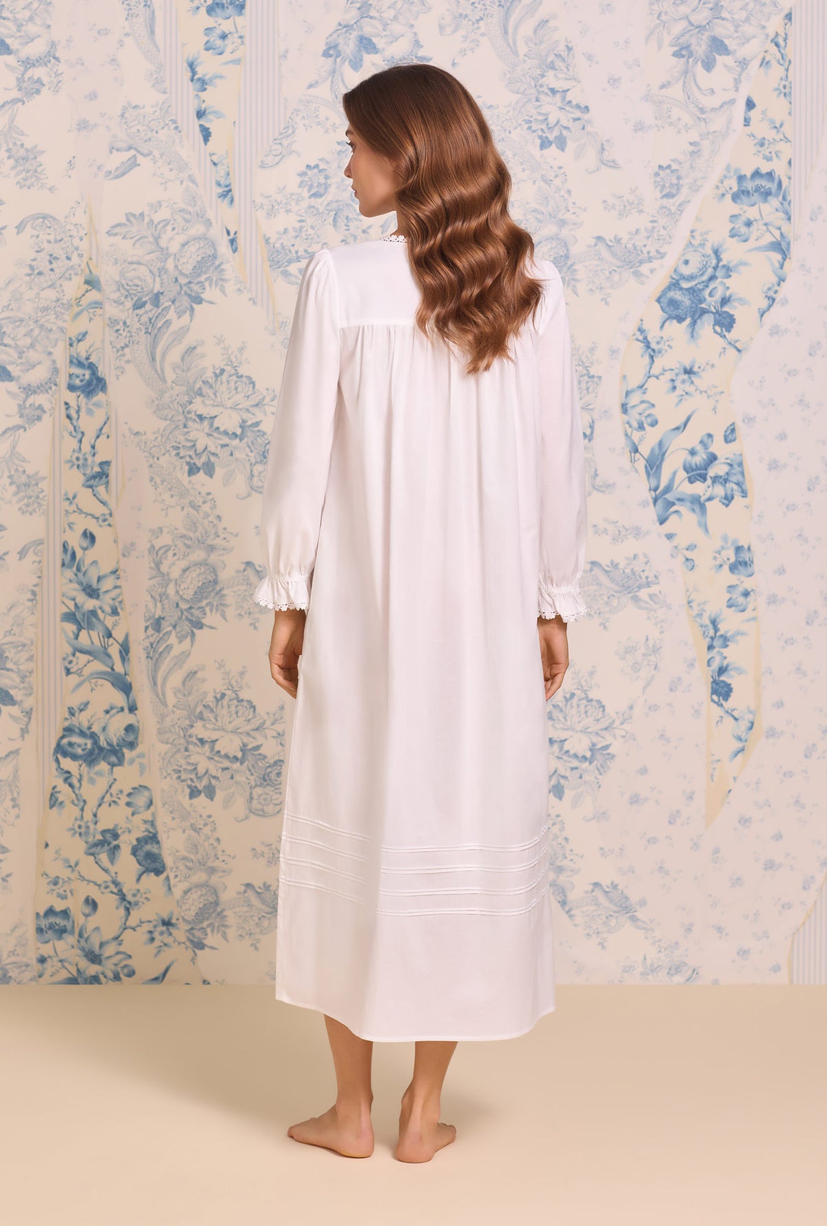A lady wearing Iconic White Cotton Lawn Long Sleeve Ballet Nightgown
