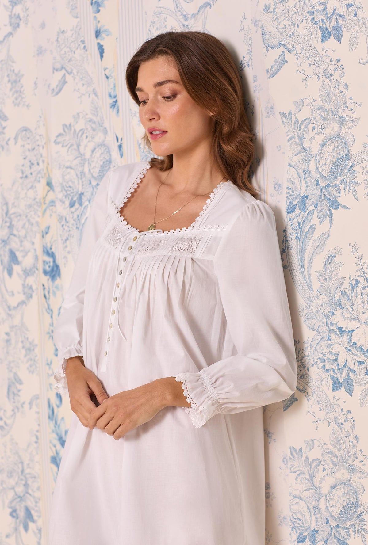 A lady wearing Iconic White Cotton Lawn Long Sleeve Ballet Nightgown
