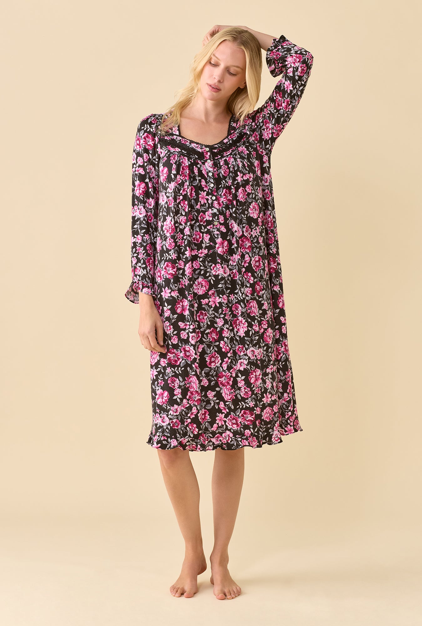A lady wearing Midnight Briar TENCEL™ Modal SpandexJersey Knit Long SleeveWaltz Nightgown one hand up