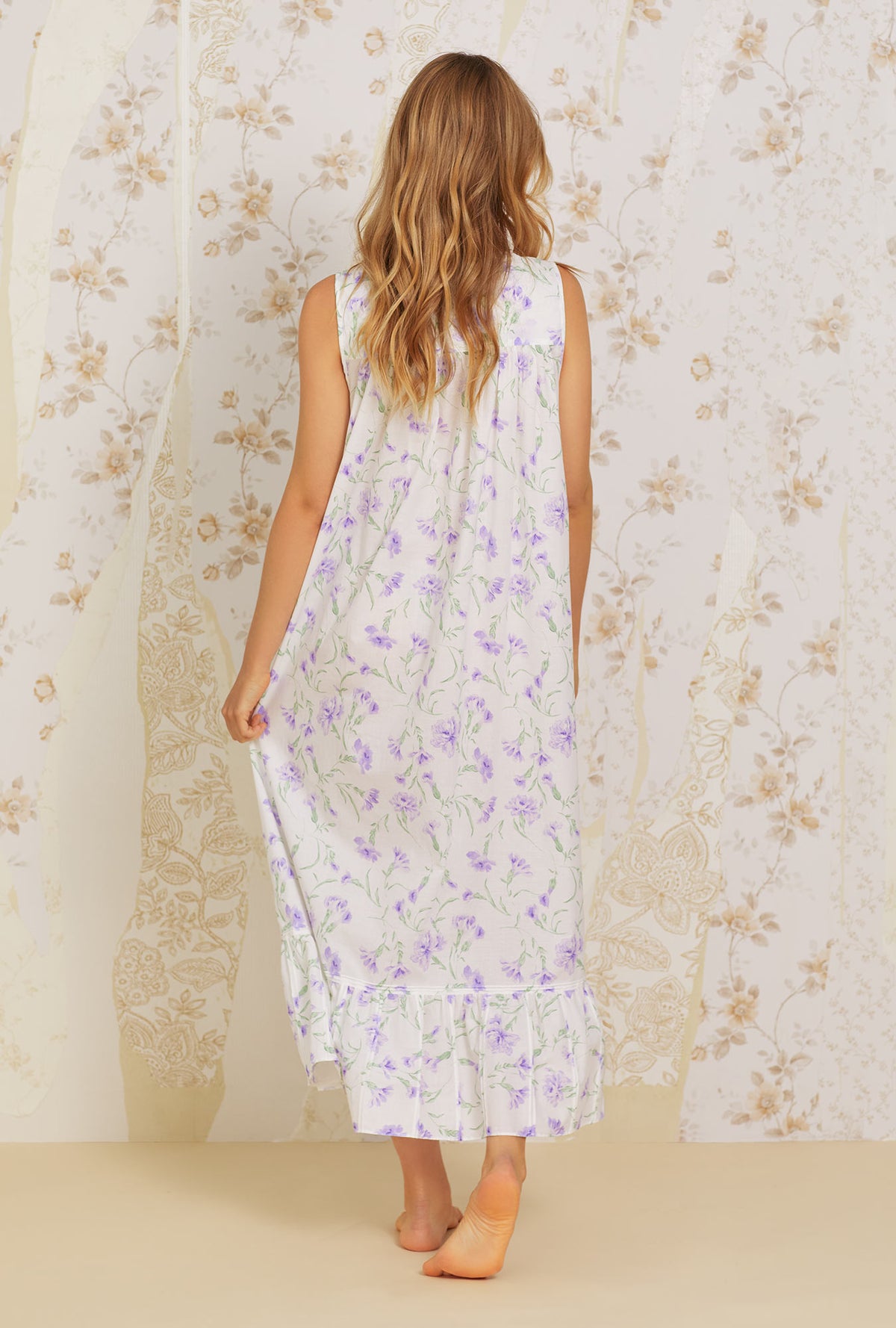 A lady wearing white  sleeveless  Cotton Nightgown with Lilac Carnation  print