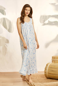 A lady wearing blue knit eileen nightgown with morning glory print.