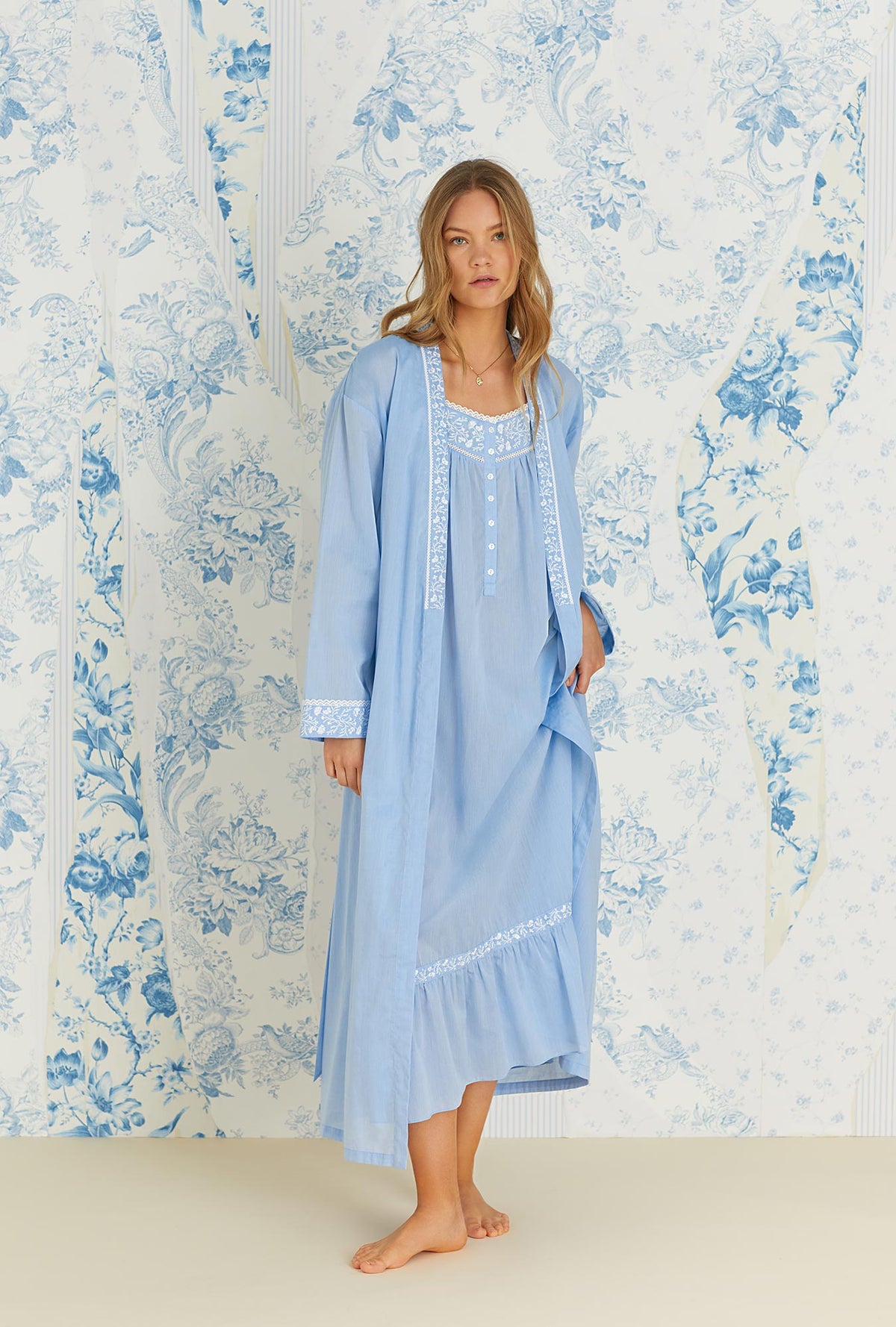 A lady wearing sleeveless blue cotton chambray genevieve nightdress.