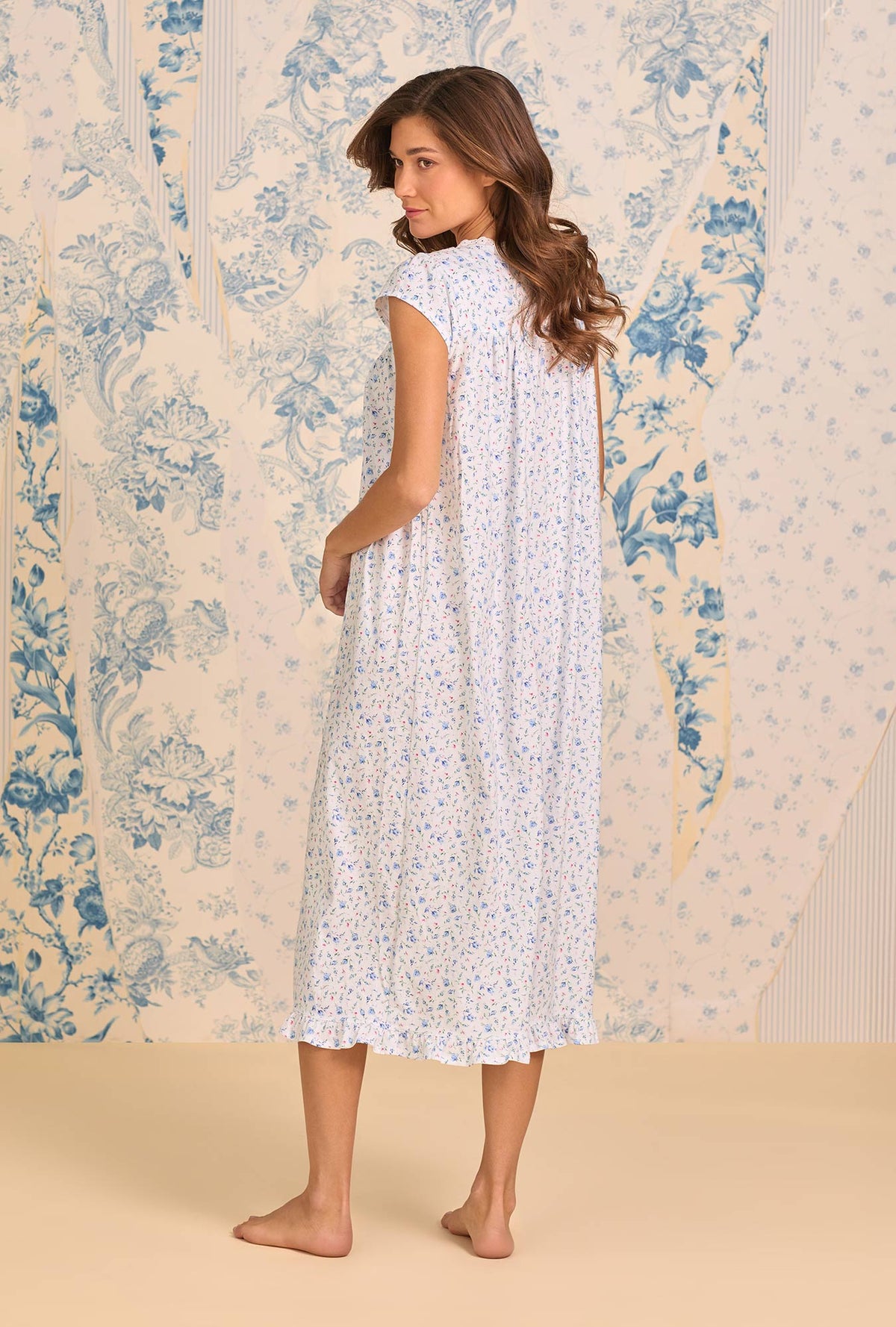 A lady wearing Catalina Rosebud Cotton Knit Cap Sleeve Ballet Nightgown back view