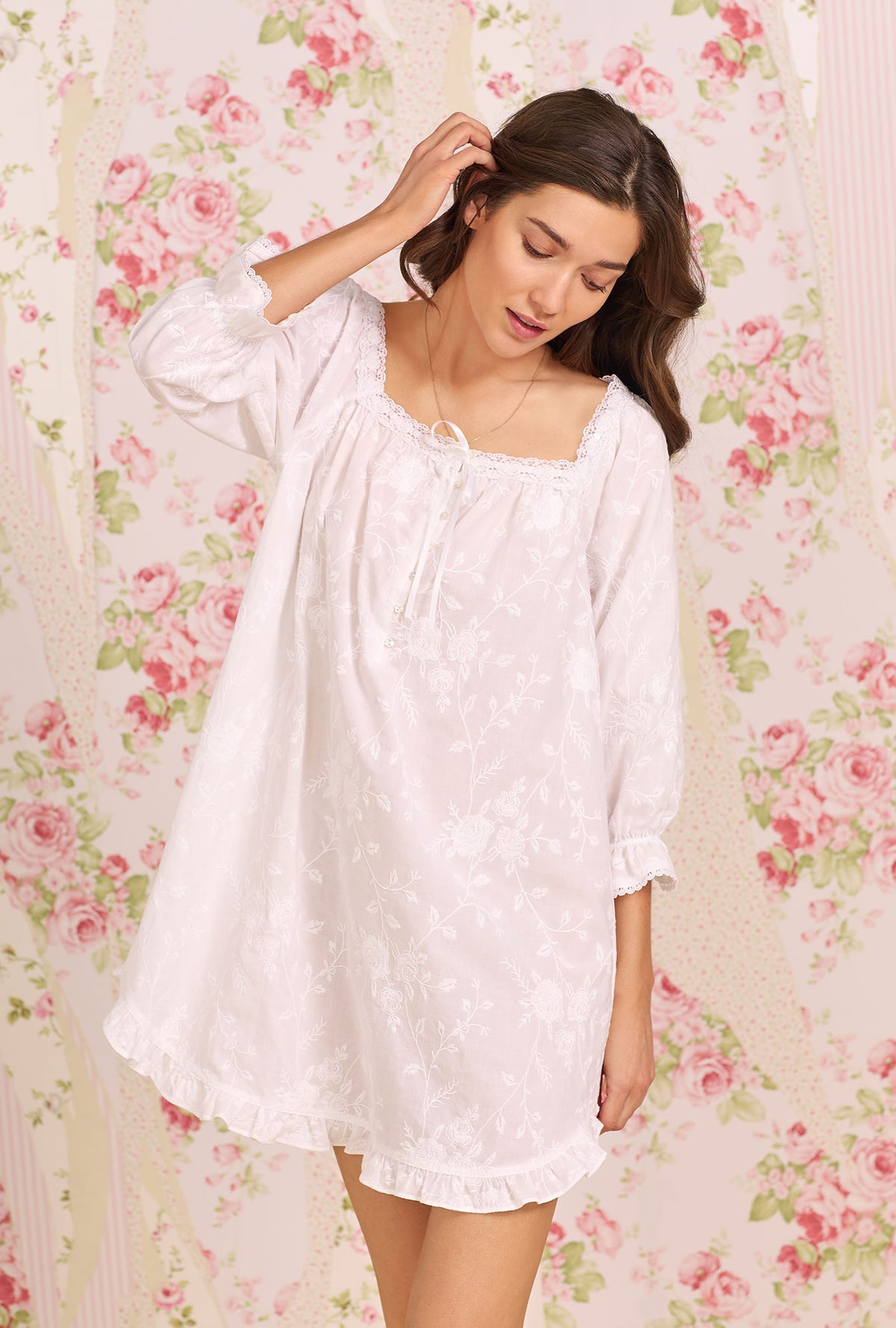 A lady wearing white short sleeve Cotton Nightshirt with Dreamy Embroidered print