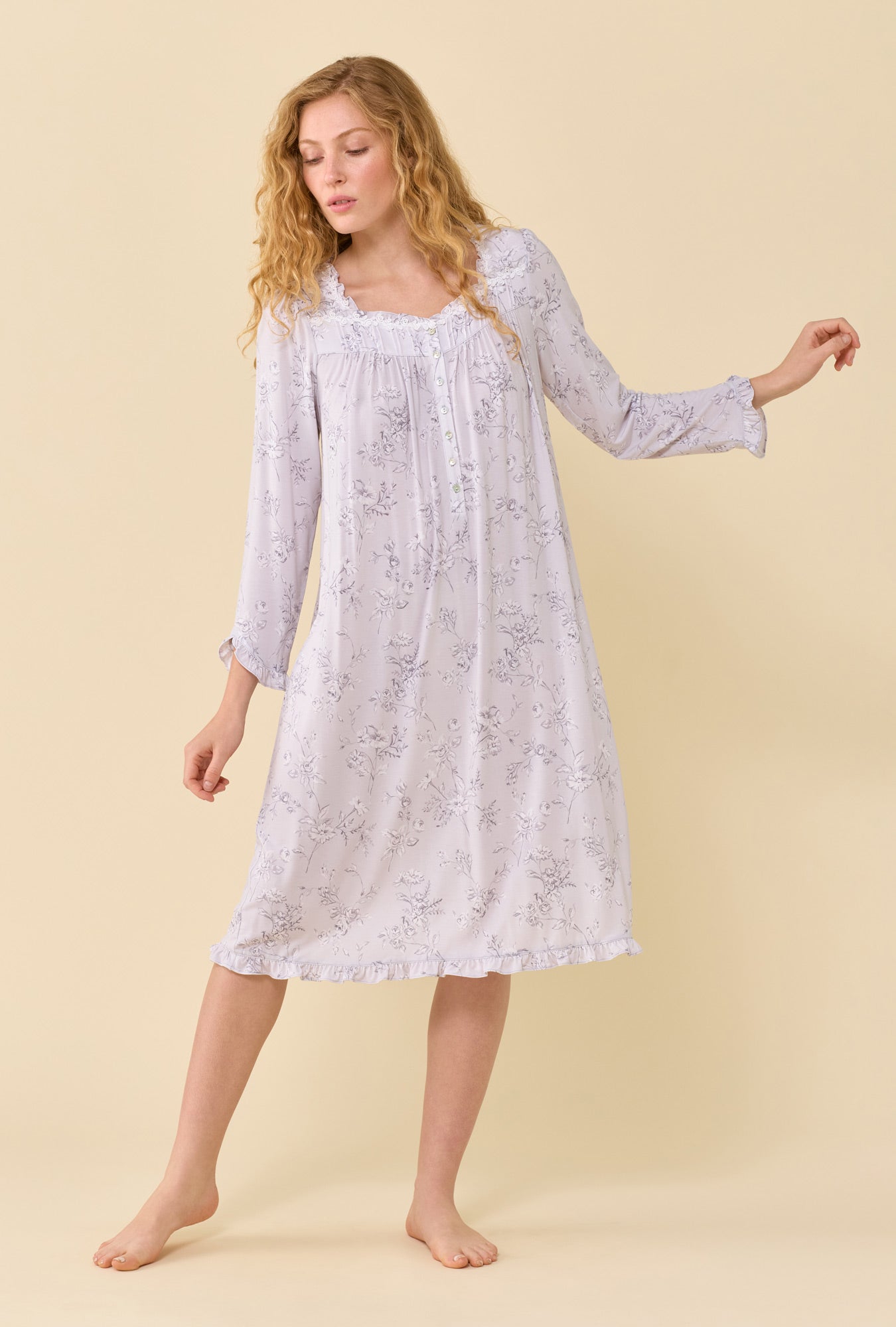 A lady wearing Silver Garden Tencel™ Modal Spandex Jersey Knit Long Sleeve Waltz Nightgown looking down