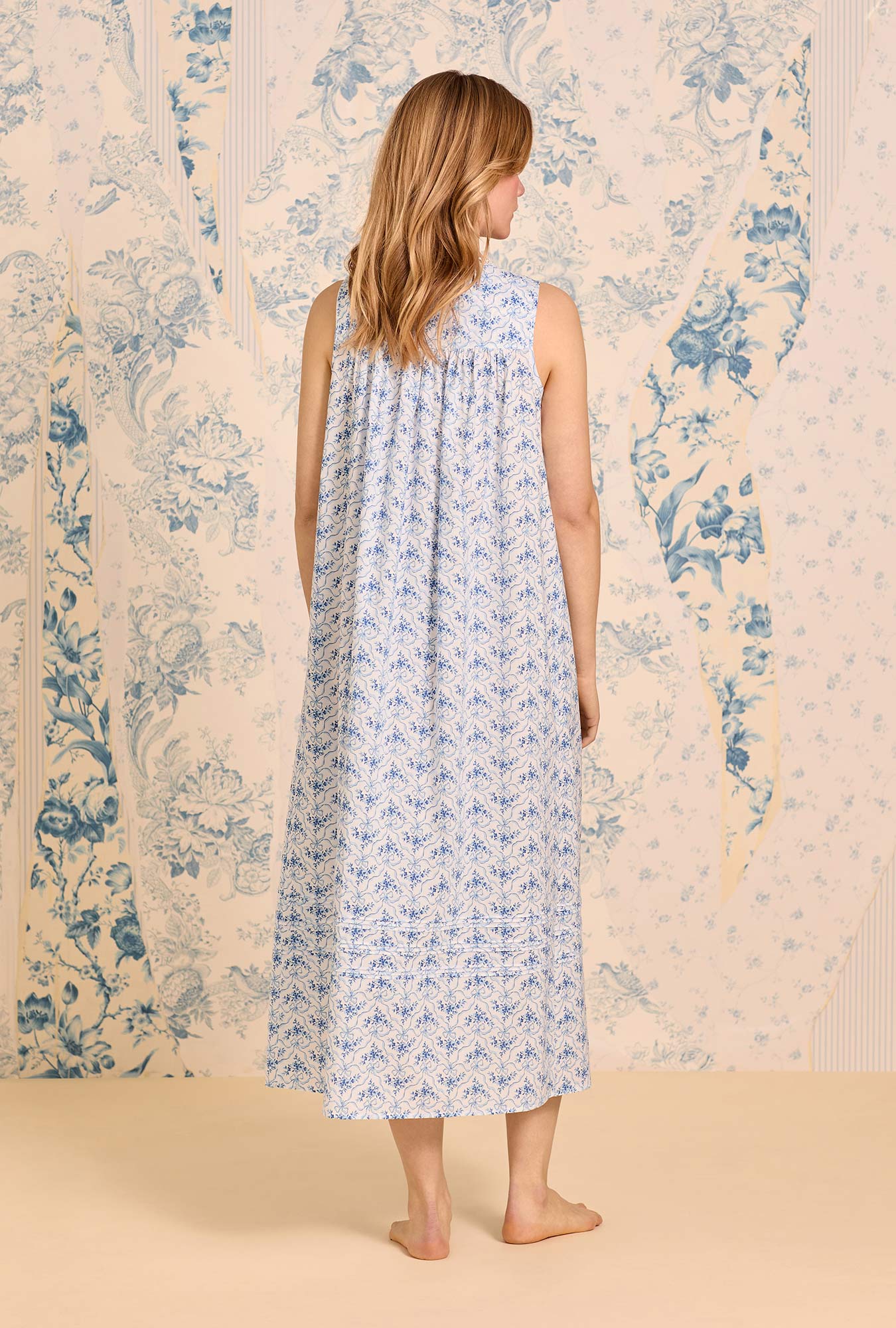 A lady wearing The "Eileen" Celestial Bow Cotton Lawn Ballet Nightgown