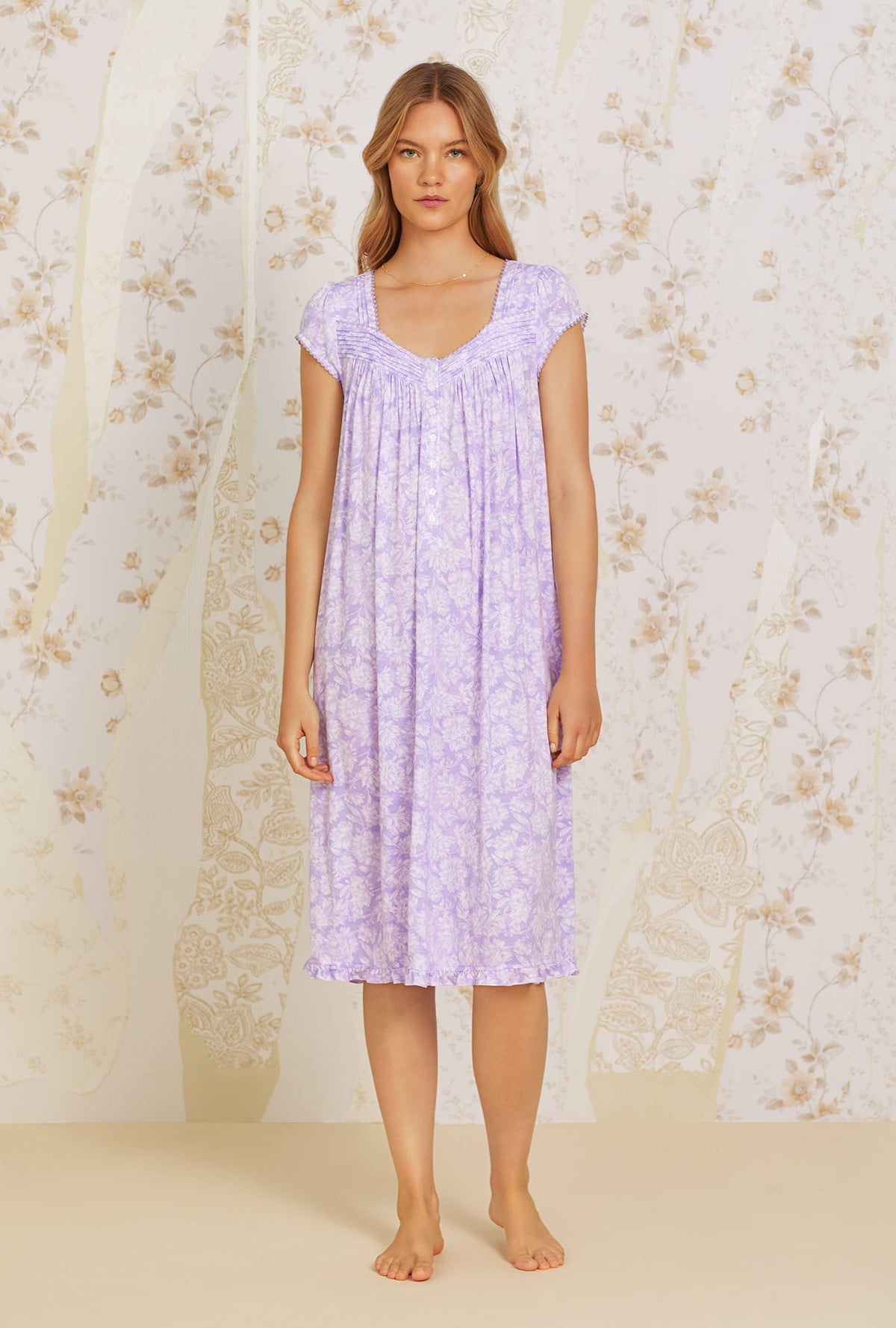 A lady wearing purple short sleeve Floral Knit Waltz Nightgown with Lilac Dream print