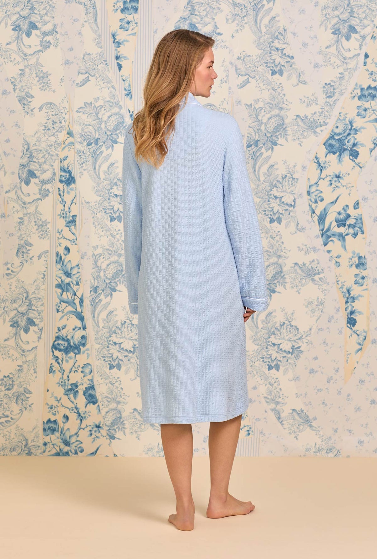 A lady wearing Sky Blue Silky Cotton Waffle Knit Waltz Button Robe