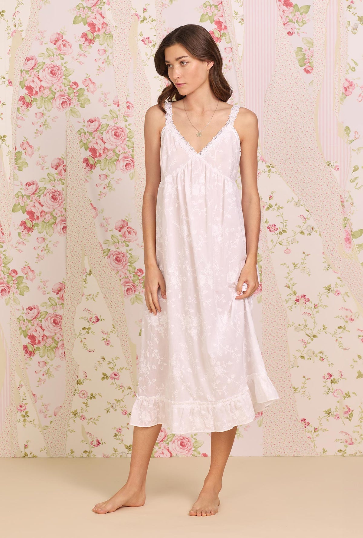 A lady wearing white sleeveless Cotton Nightgown with Dreamy Embroidered print