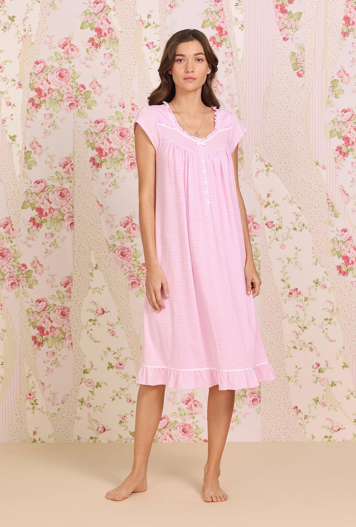 A lady wearing pink stripe knit waltz nightgown