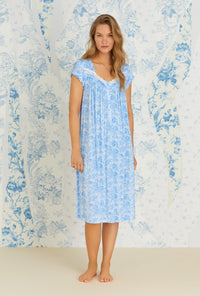 A lady wearing cap sleeve tencel blue denim roses knit waltz nightgown.