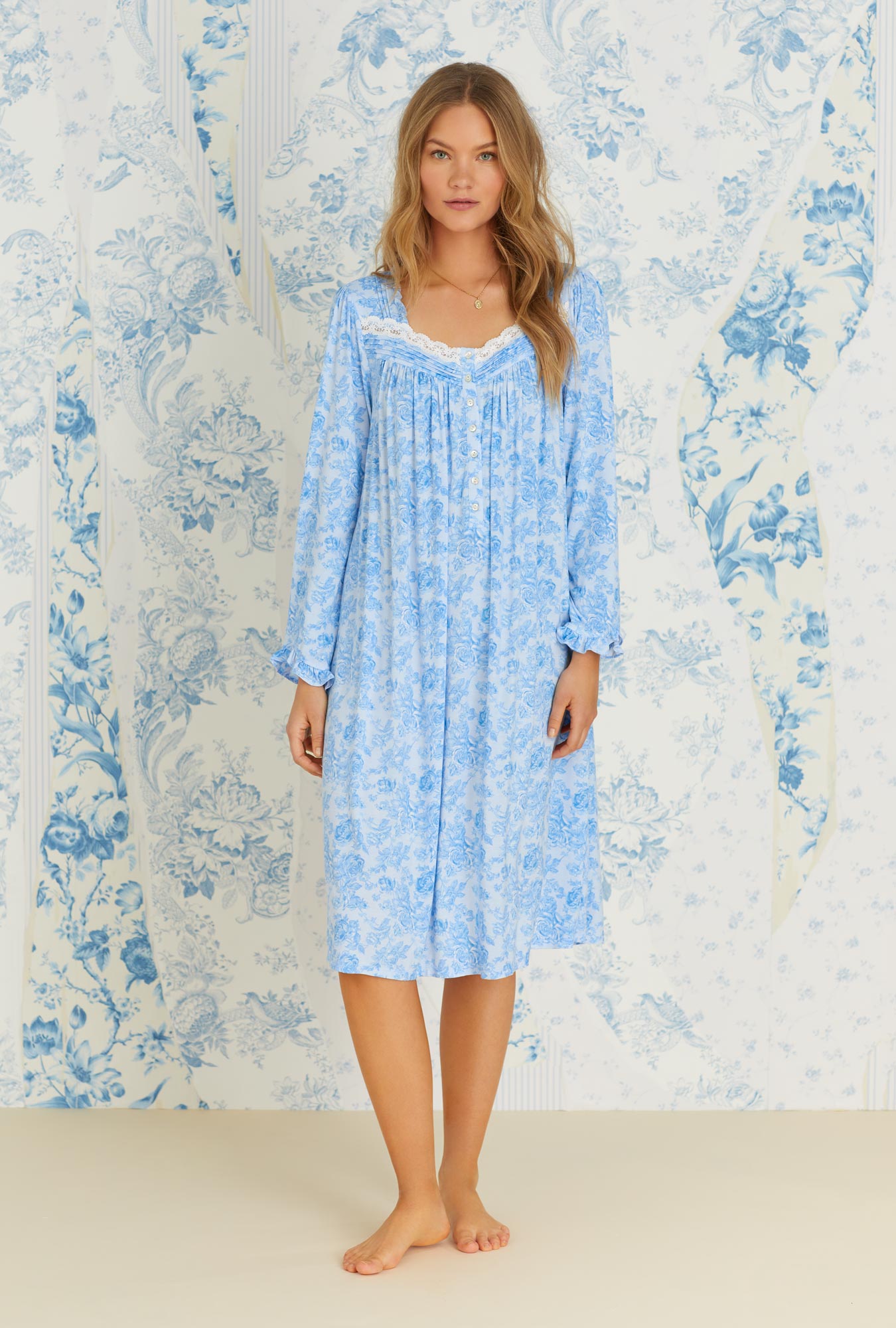 A lady wearing long sleeve tencel blue denim roses knit waltz nightgown.