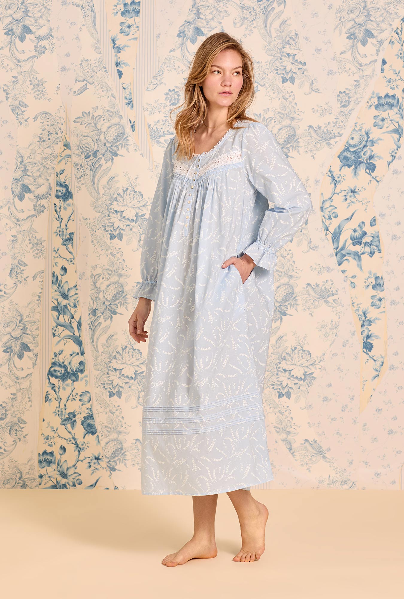 A lady wearing Moonlit Lily Long Sleeve Cotton Lawn Ballet Nightgown