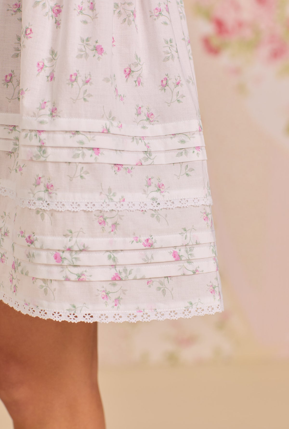 A Lady Wearing The "Isabelle" Petite Rose Cotton Lawn Chemise showing a detail close up view