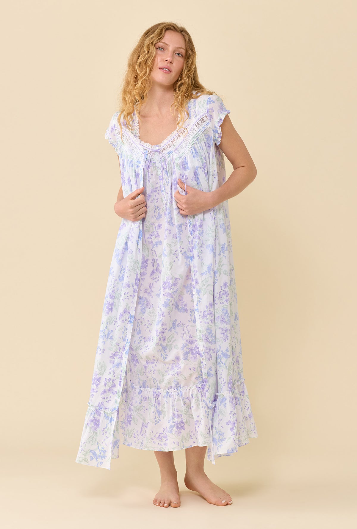A Lady Wearing The Eileen Blooming Arbor Nightgown in a front view pose and styled with a robe
